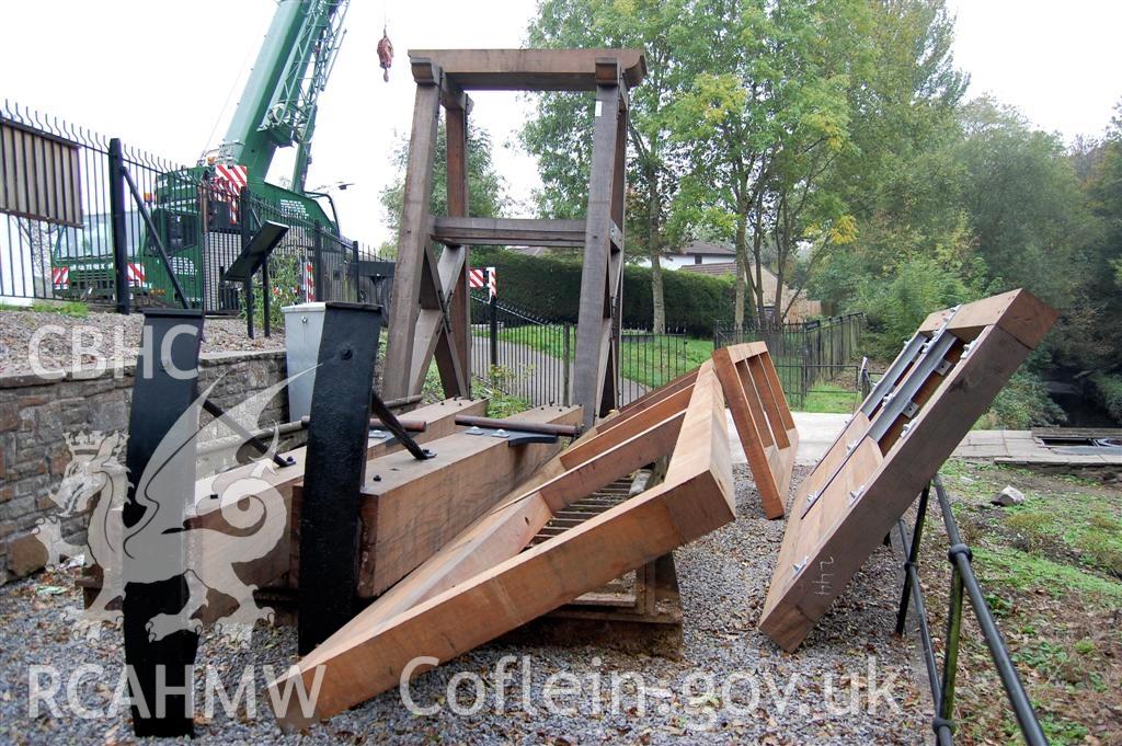 Digital image relating to Melingriffith Water Pump: Replacement rocker beams and associated metal work, sluice gate, and filter screen frames being delivered to temporary location on site.