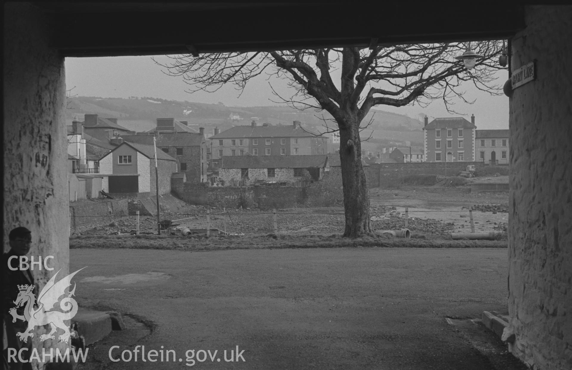 Black and White photograph showing Aberaeron Harbour from the arch of Drury Lane. Photographed by Arthur Chater in February 1962. Taken from grid ref: SN 4568 6294, looking south east.