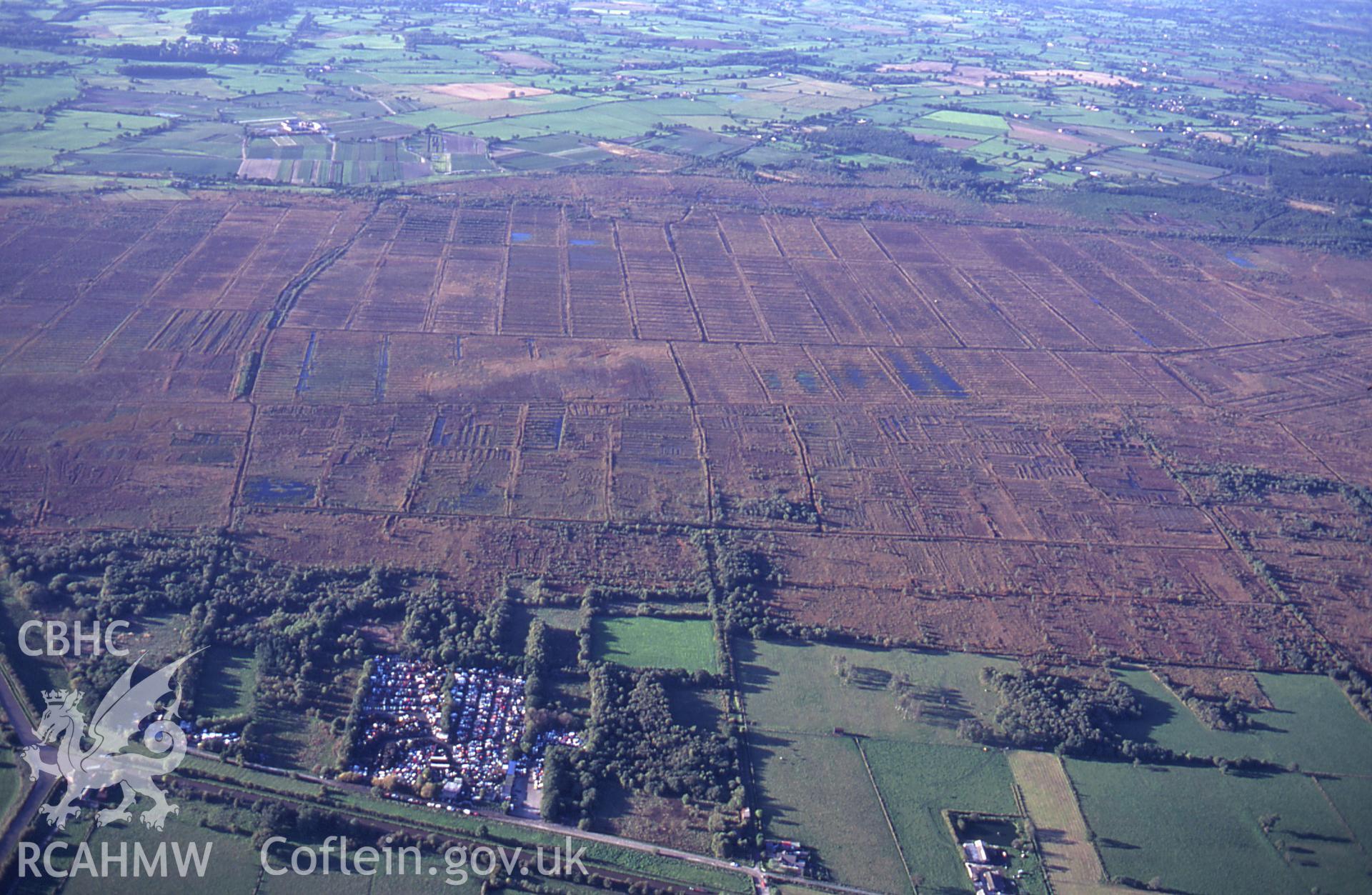 RCAHMW colour slide oblique aerial photograph of Fenn's Moss Peat Processing, Bronington, taken by C.R. Musson, 04/10/94