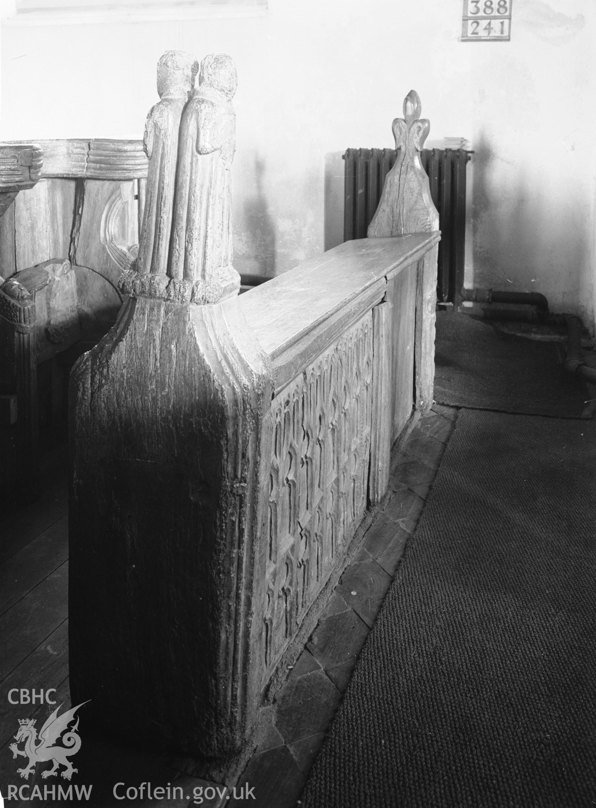 Interior view showing double figure finial on the stalls.