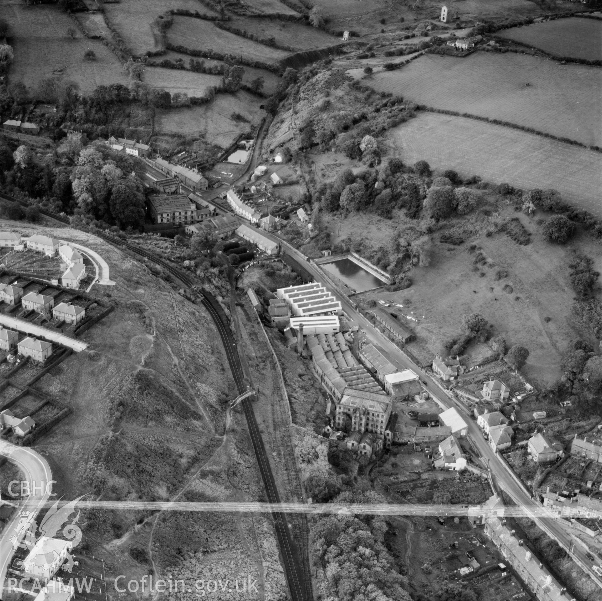 View of Holywell, commissioned by Holywell Textile Mills Ltd., showing industrial buildings and housing estate