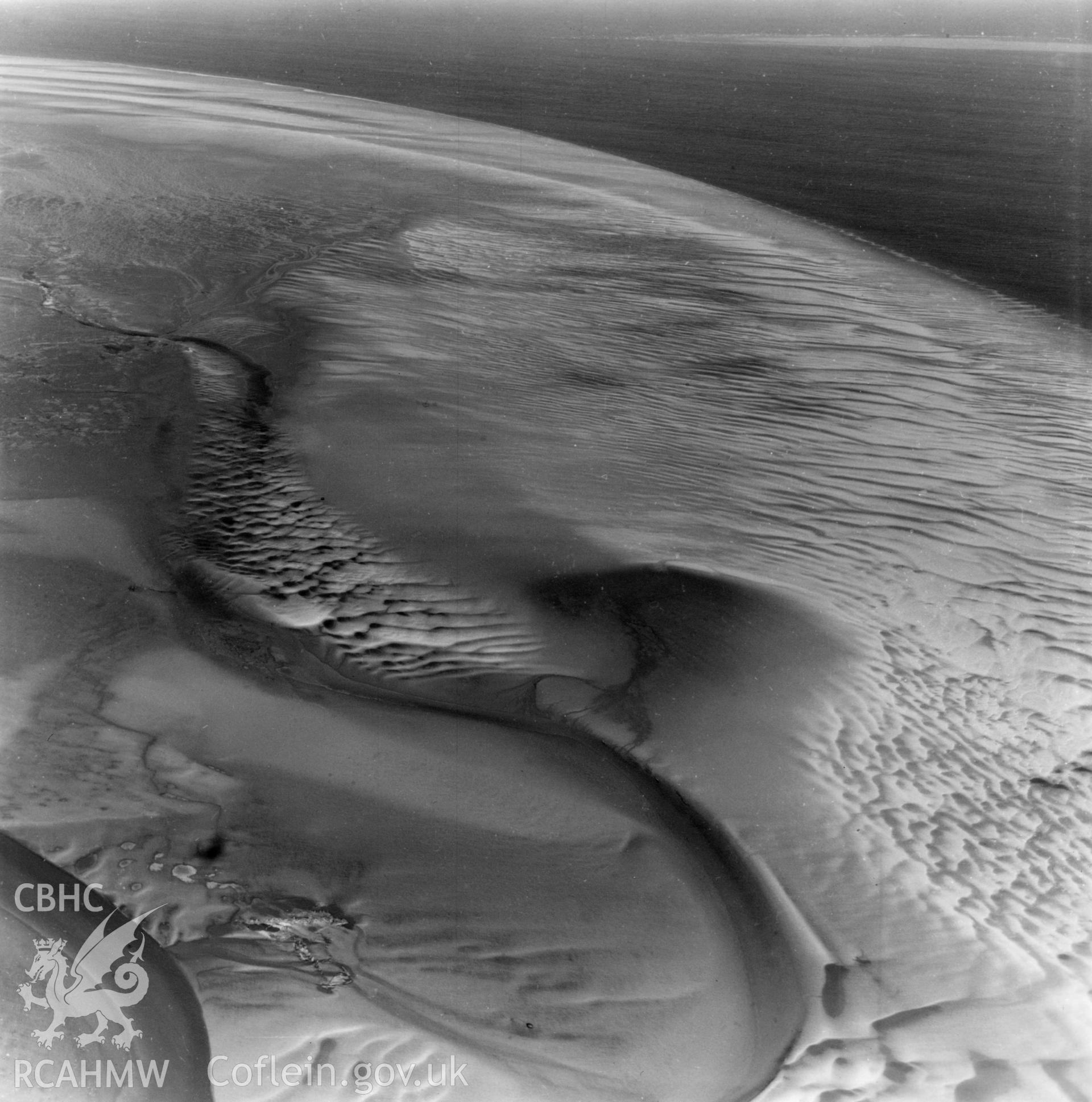 View of mudflats at Point of Ayr. Oblique aerial photograph, 5?" cut roll film.