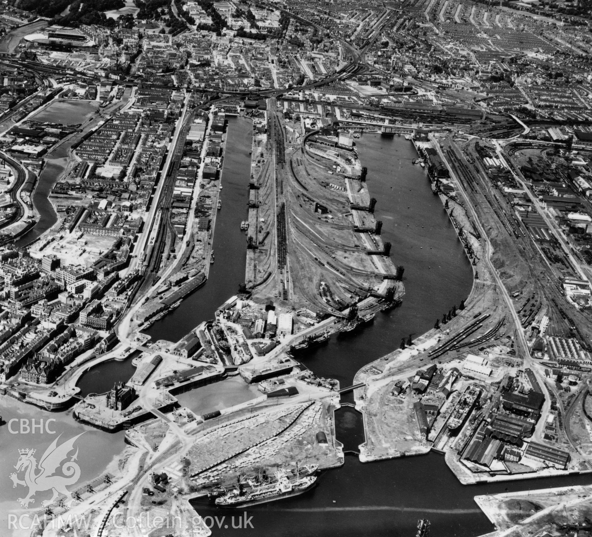View of Cardiff docks from the south showing East and West Butes docks. Oblique aerial photograph, 5?" cut roll film.
