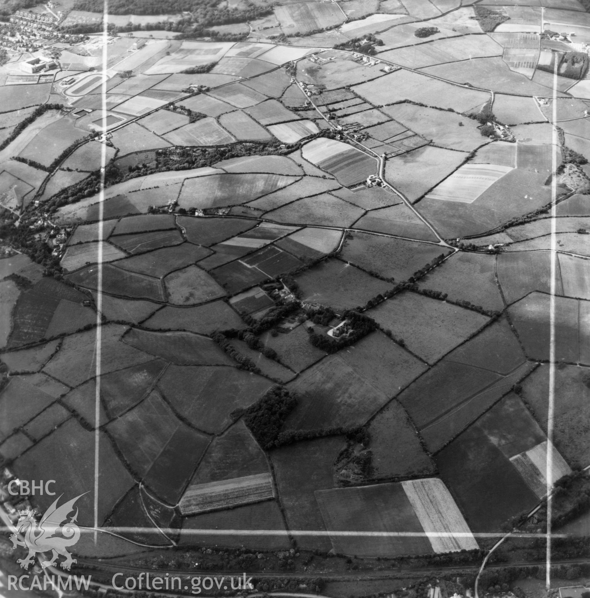 View of landscape above Llanbadarn village showing site of Agricultural college and Plas Lluest, commissioned by J.E. Nichols. Oblique aerial photograph, 5?" cut roll film.