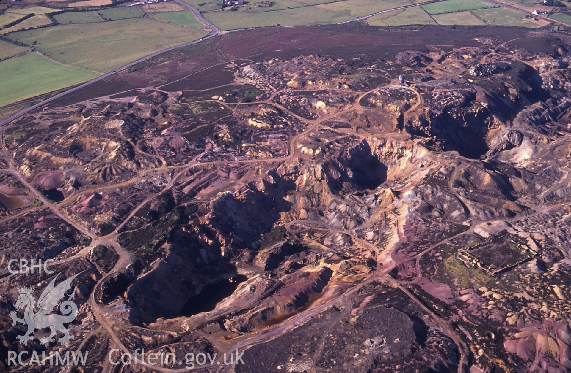 Slide of RCAHMW colour oblique aerial photograph of Parys Mountain Copper Mines, Amlwch, taken by C.R. Musson, 11/7/1989.