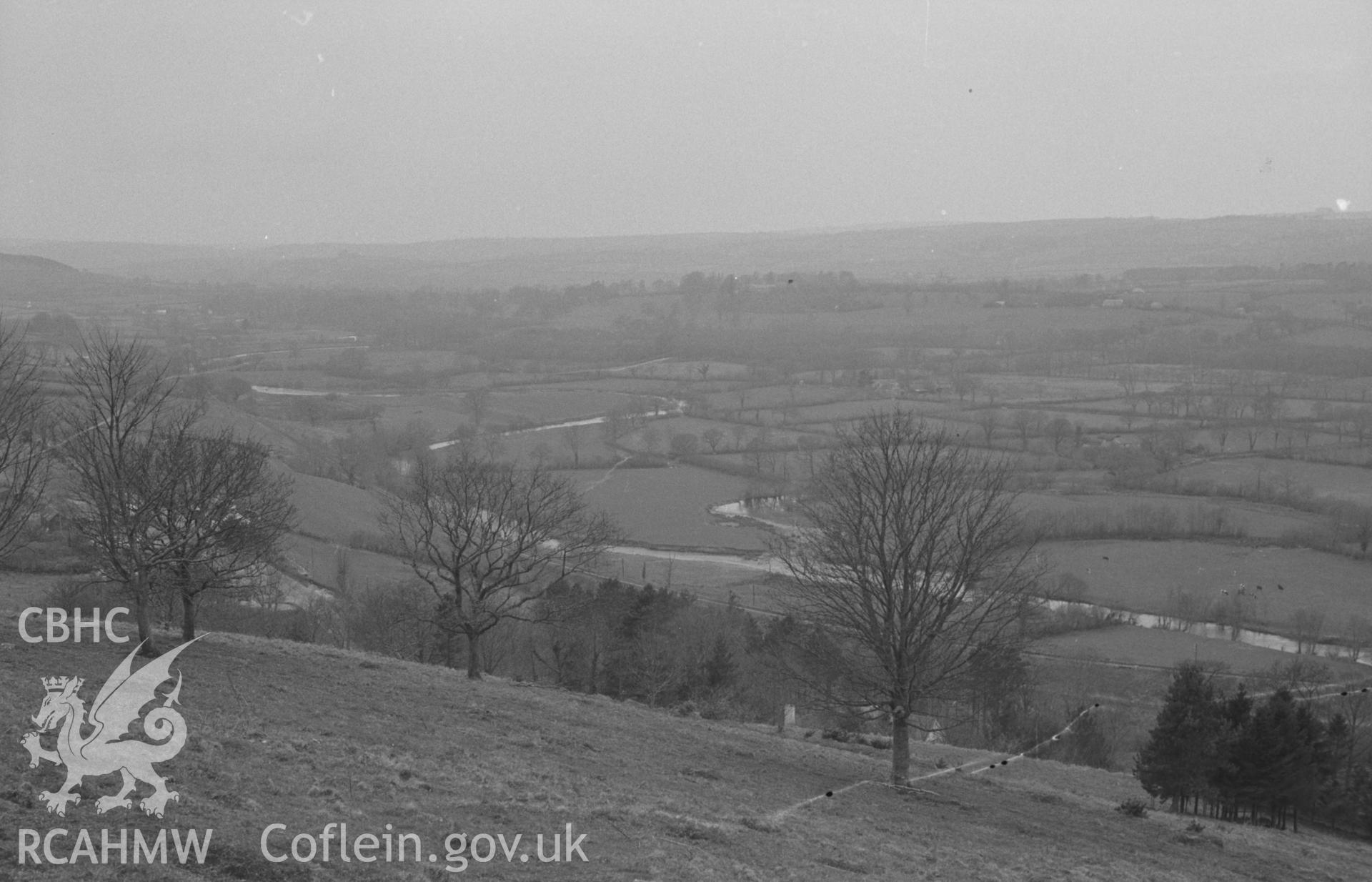 Digital copy of a black and white negative showing view looking from the top of Pen-y-Gaer across the Teifi to Highmead near Llanybyther. Photographed by Arthur O. Chater in April 1967 looking west from Grid Reference SN 523 434.