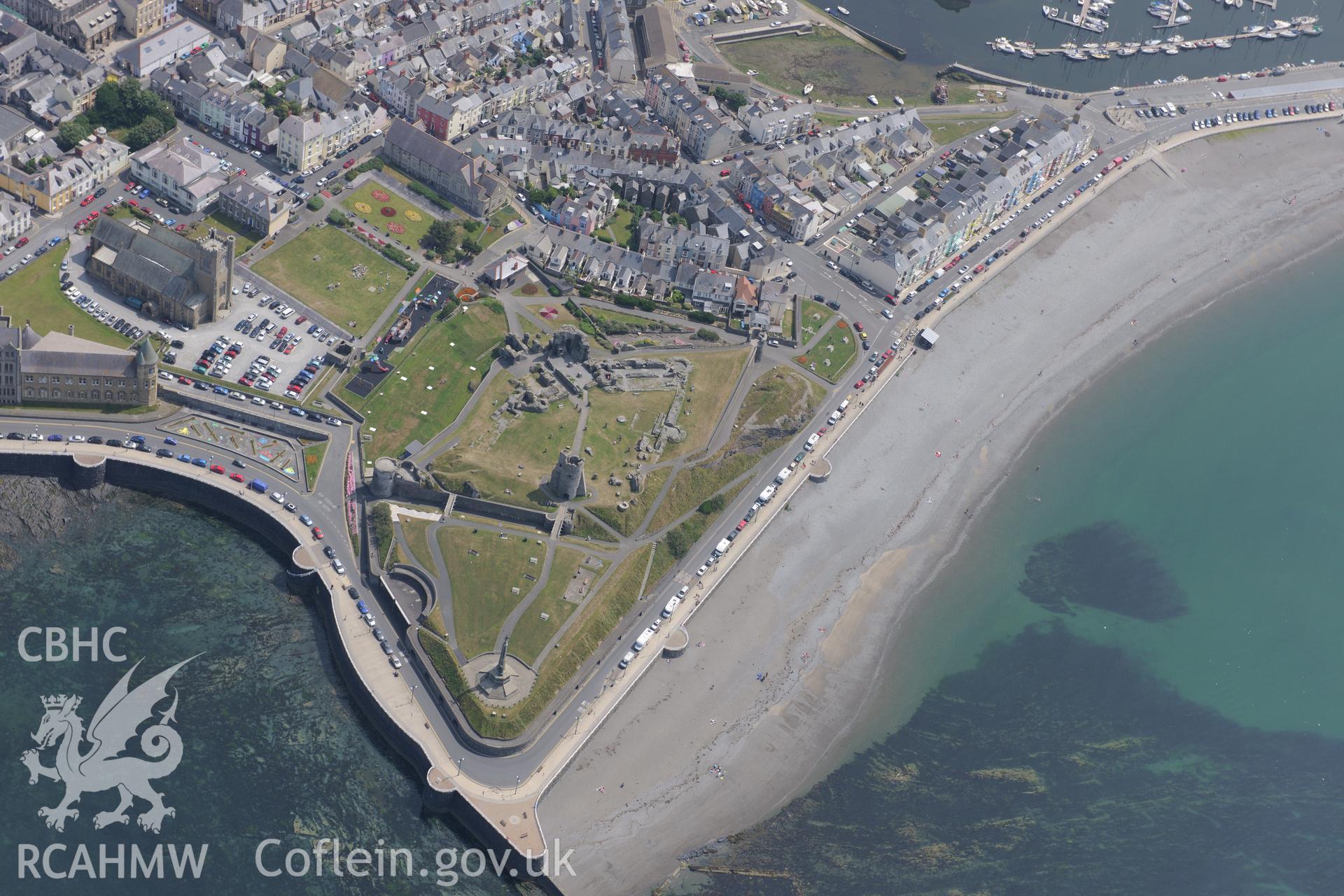 View of Aberystwyth including the the Castle, the War Memorial, St Michael's Church, and South Beach. Oblique aerial photograph taken during the Royal Commission?s programme of archaeological aerial reconnaissance by Toby Driver, 12th July 2013.