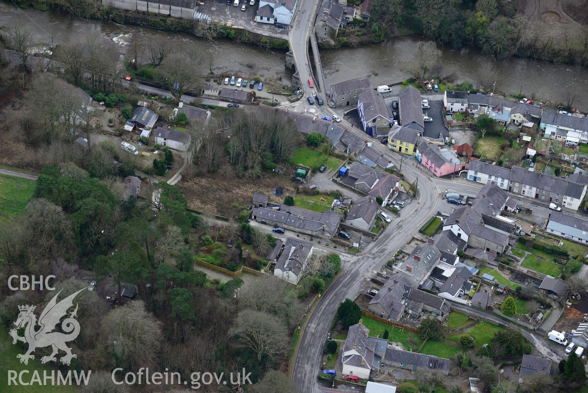 Adpar motte and Newcastle Emlyn Bridge, Newcastle Emlyn. Oblique aerial photograph taken during the Royal Commission's programme of archaeological aerial reconnaissance by Toby Driver on 13th March 2015.