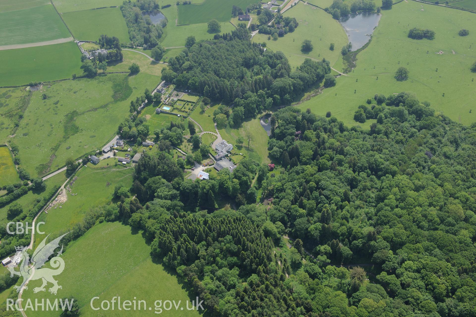 Evancoyd country house, garden and stables, also a mound at Evancoyd. Oblique aerial photograph taken during the Royal Commission's programme of archaeological aerial reconnaissance by Toby Driver on 11th June 2015.