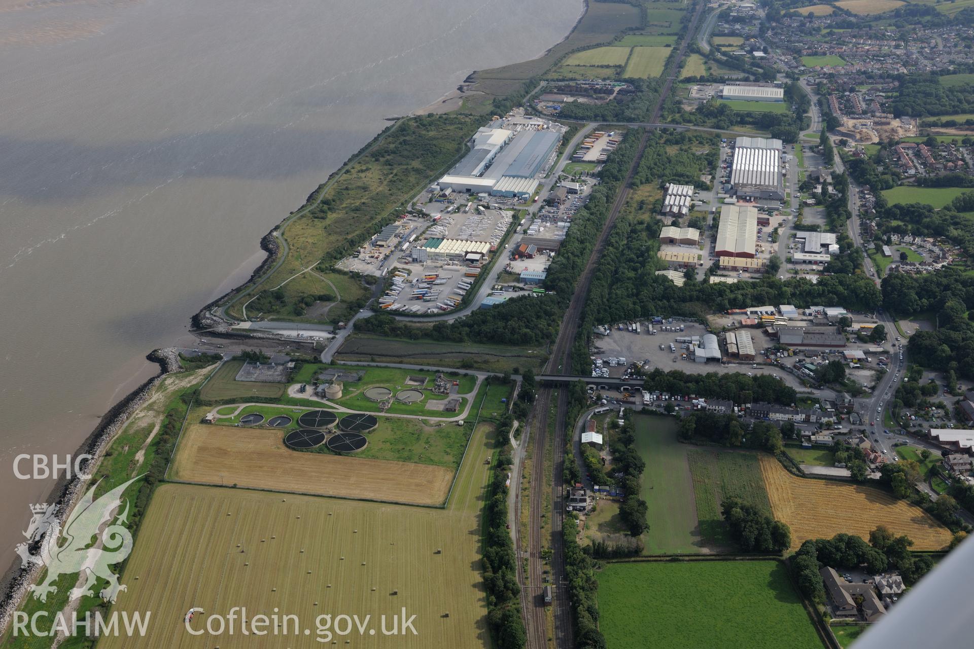 Courtaulds Factory or Greenfield Works, and the town of Holywell. Oblique aerial photograph taken during the Royal Commission's programme of archaeological aerial reconnaissance by Toby Driver on 11th September 2015.
