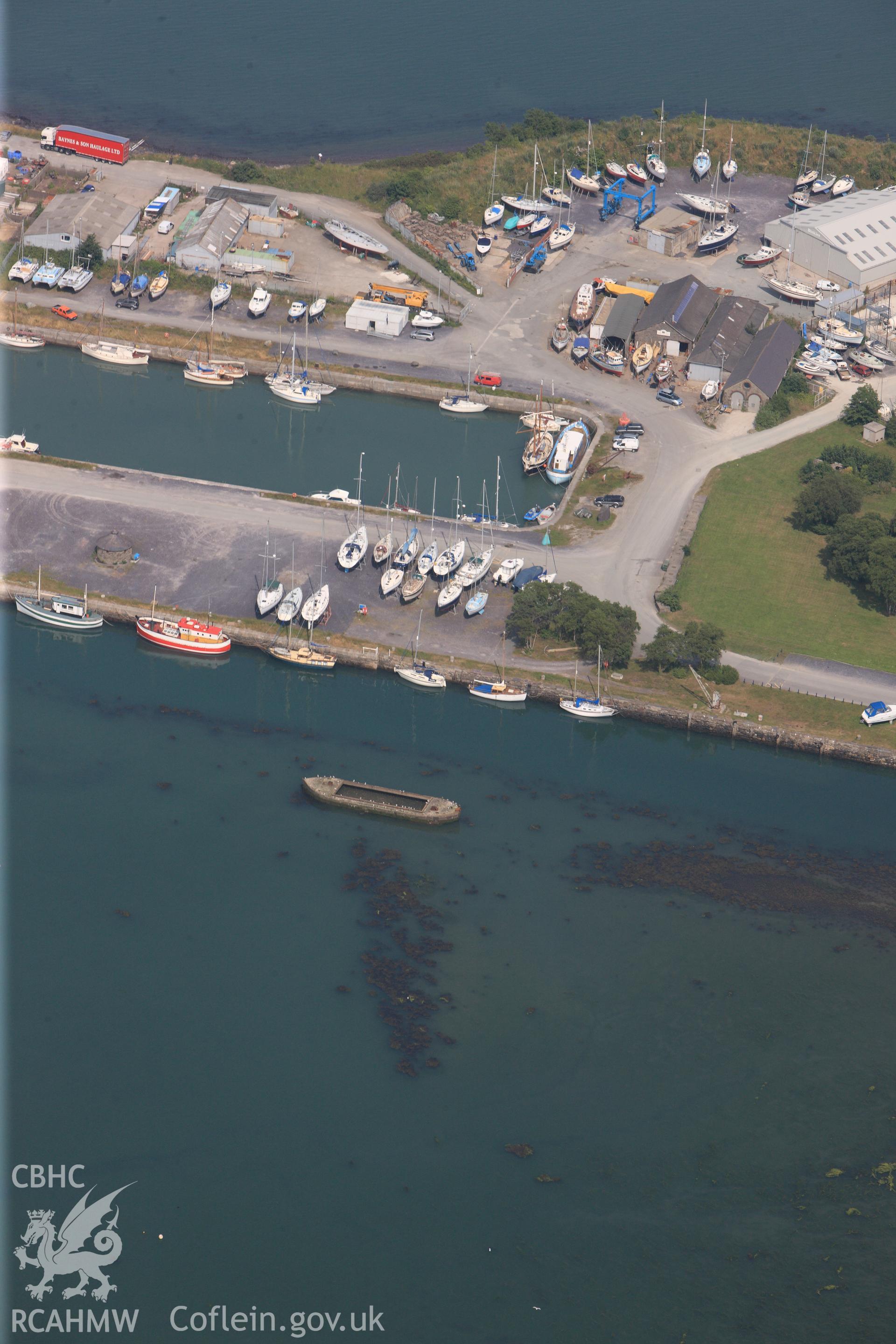 Port Penrhyn harbour, Abercegin, Bangor. Oblique aerial photograph taken during the Royal Commission?s programme of archaeological aerial reconnaissance by Toby Driver on 12th July 2013.