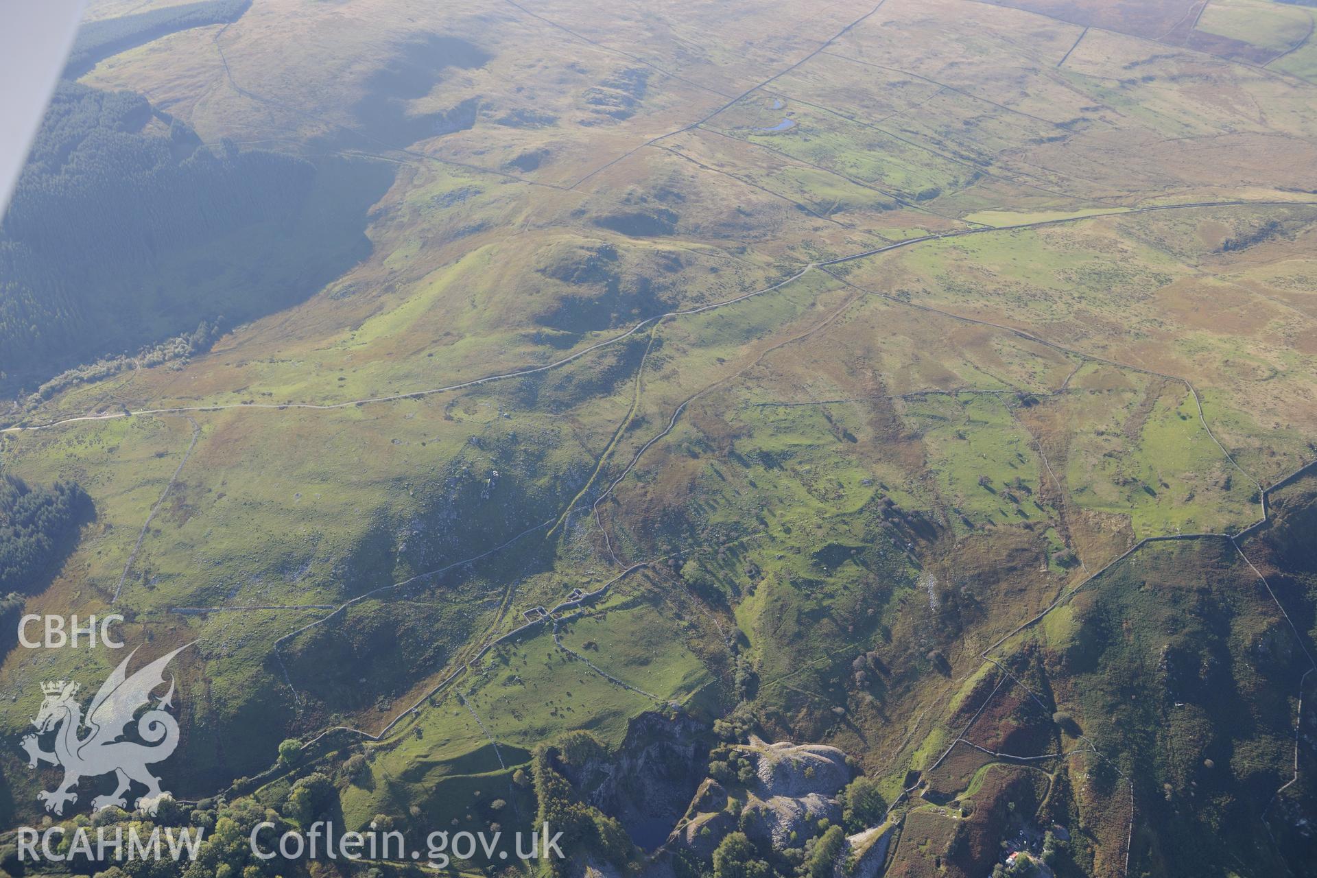 Goleuwern slate quarry, Hen-ddol slate quarry and hut circles south east of Mynydd Craig Wen, near Fairbourne. Oblique aerial photograph taken during the Royal Commission's programme of archaeological aerial reconnaissance by Toby Driver on 2nd October 2015.