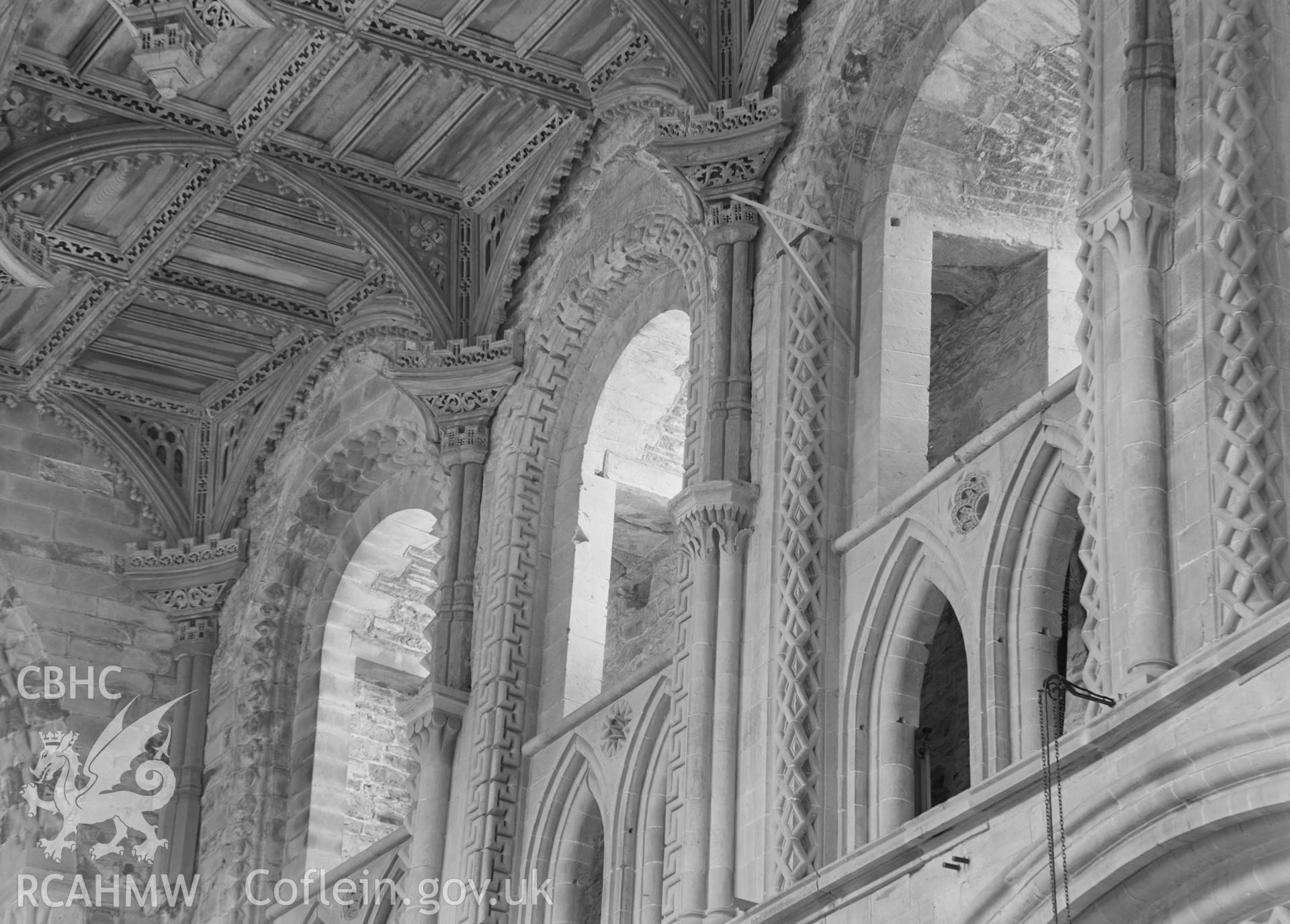 Digital copy of a black and white acetate negative showing decorated arches and ceiling pendants in St. David's Cathedral, taken by E.W. Lovegrove, July 1936.