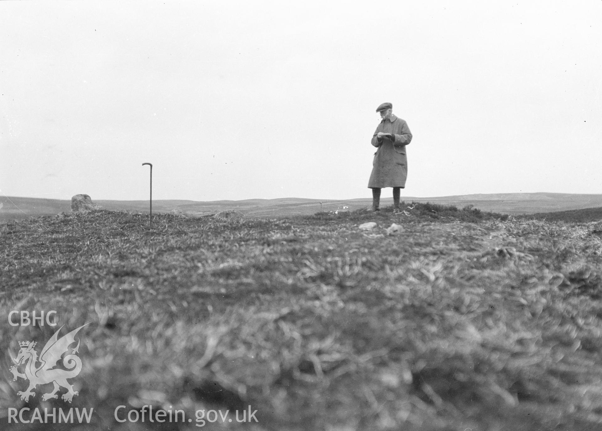 Digital copy of a nitrate negative showing Bryn Beddau round barrows. Back of negative copy dates the photograph to 'July 1930.' From the Cadw Monuments in Care Collection.