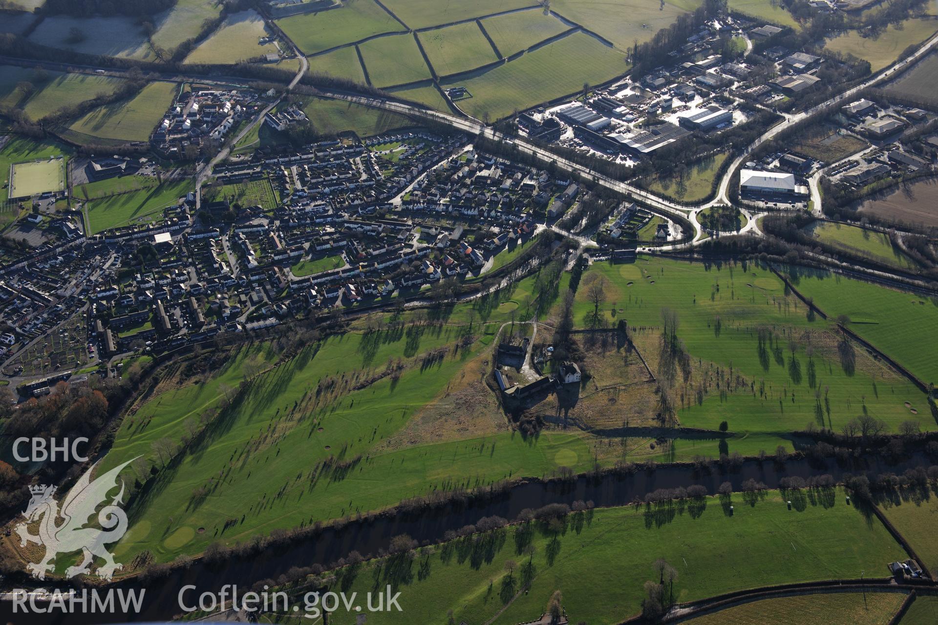 Newtown Farm with associated house, outbuildings and garden features, and the town of Brecon beyond. Oblique aerial photograph taken during the Royal Commission?s programme of archaeological aerial reconnaissance by Toby Driver on 15th January 2013.