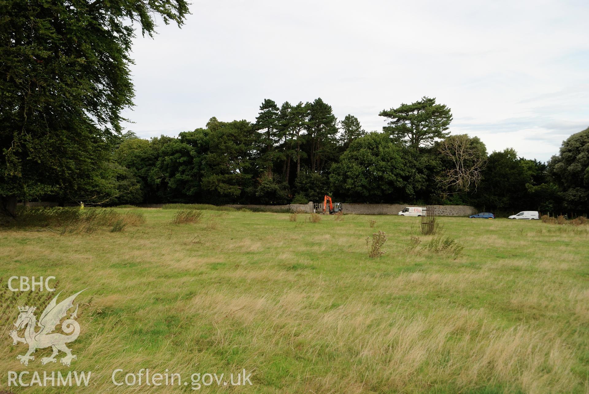 'General view from distance encompassing full 50m length of evaluation area, view from the south.' Photographed during archaeological evaluation of Kinmel Park, Abergele, conducted by Gwynedd Archaeological Trust on 22nd August 2018. Project no. 2571.
