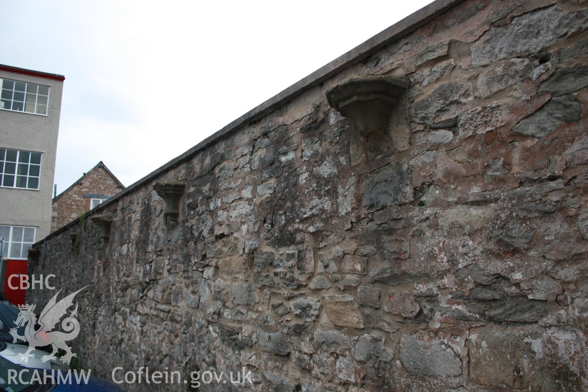 Colour photograph showing exterior view of stone wall at the old butcher's market, Denbigh borough market. Photographed during survey conducted by Geoff Ward, circa 2010.