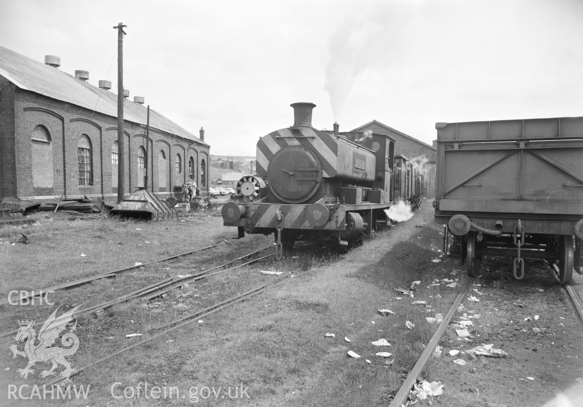 Digital copy of an acetate negative showing Big Pit - Steam loco working outside engine sheds, from the John Cornwell Collection.