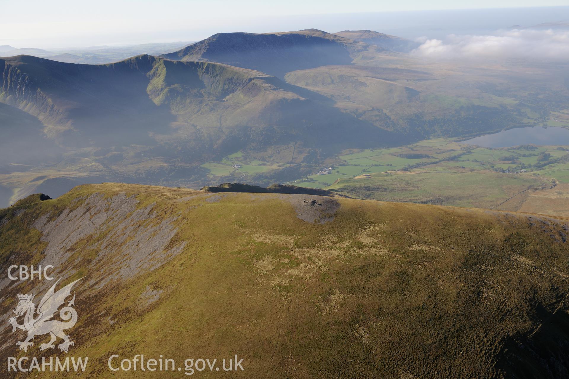 Mynydd Mawr cairn near Nantlle. Oblique aerial photograph taken during the Royal Commission's programme of archaeological aerial reconnaissance by Toby Driver on 2nd October 2015.