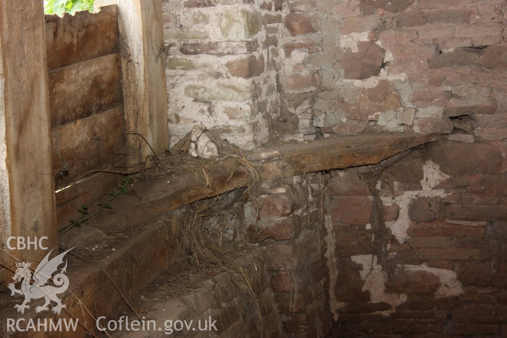 Internal wooden panelling and brick wall. Photographic survey of Marian Mawr in Cwm, Denbighshire by Geoff Ward on 20th August 2010.