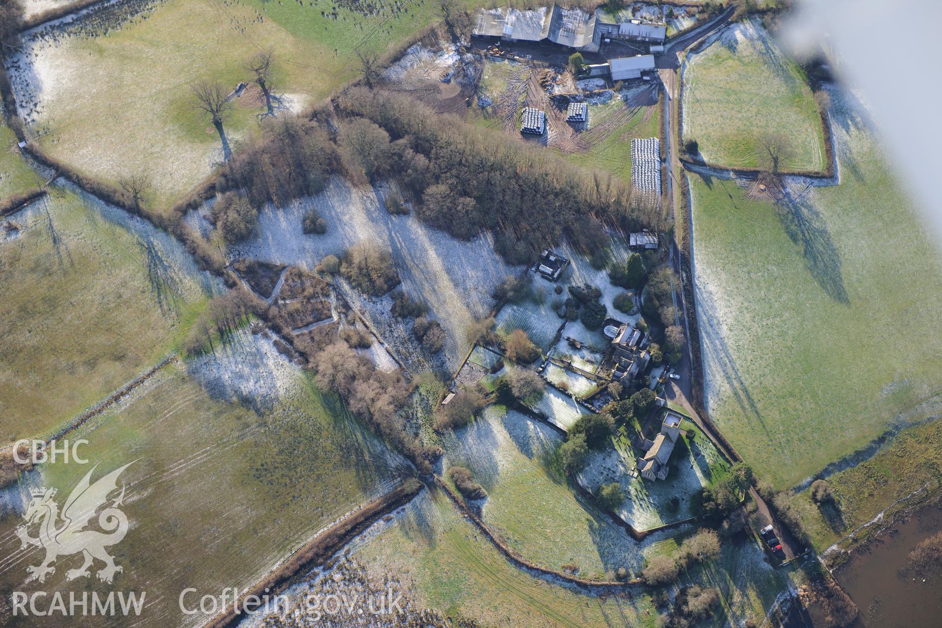 St. Gastyn's church, the village of Llangasty-Talyllyn and surrounding fields, south east of Brecon. Oblique aerial photograph taken during the Royal Commission?s programme of archaeological aerial reconnaissance by Toby Driver on 15th January 2013.