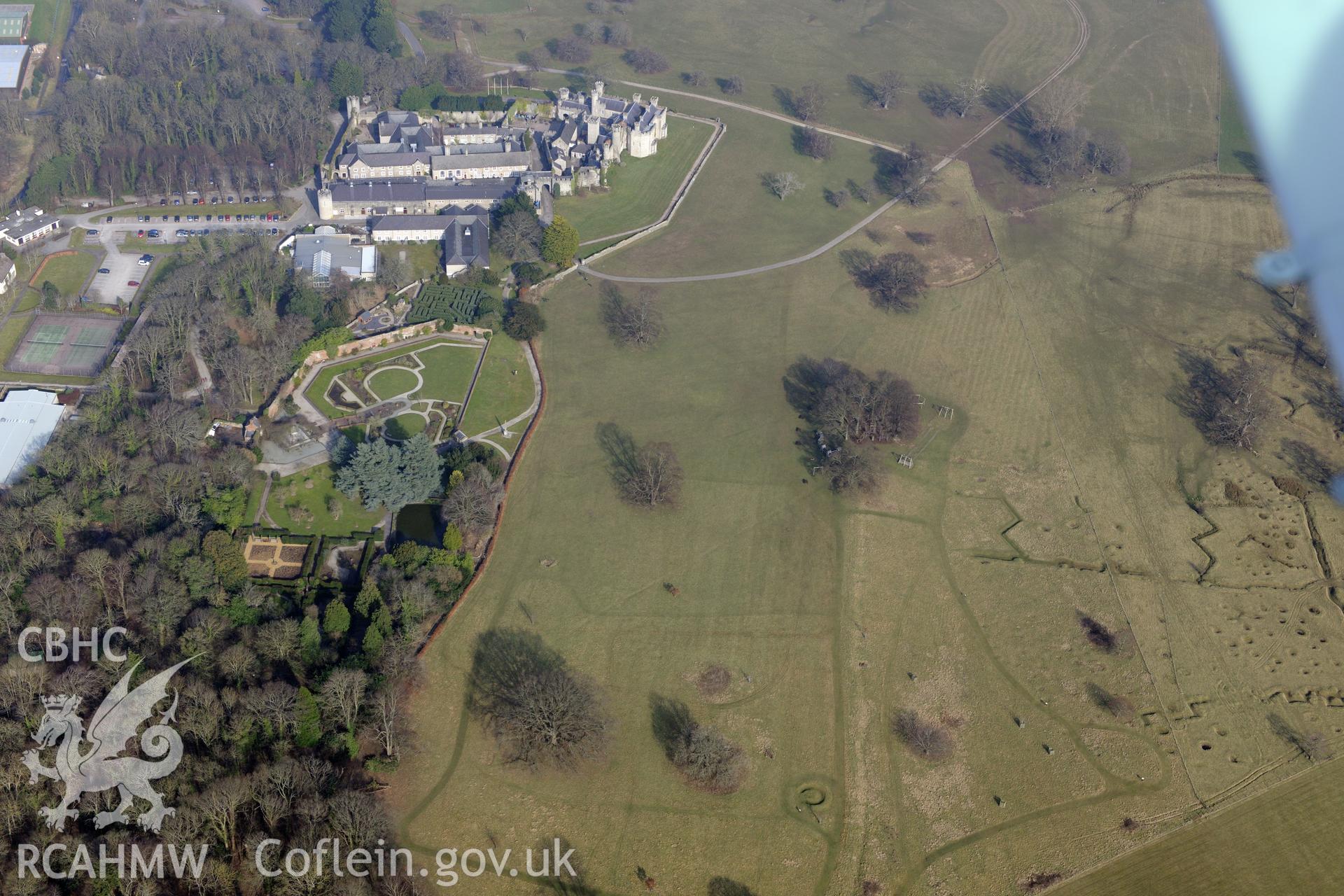 Bodelwyddan Castle, its garden, and Bodelwyddan Park army practise trenches, west of St. Asaph. Oblique aerial photograph taken during the Royal Commission?s programme of archaeological aerial reconnaissance by Toby Driver on 28th February 2013.
