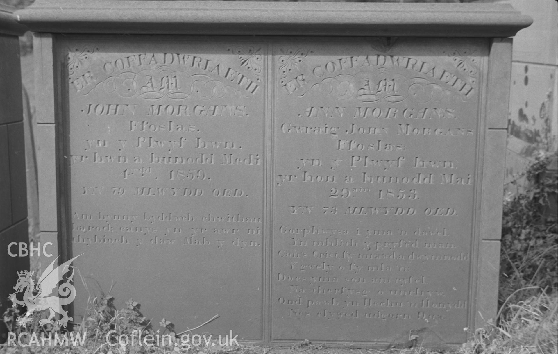 Digital copy of a black and white negative showing detailed view of gravestone in memory of the Morgans family of Ffoslas at St. Non's Church, Llanerchaeron. Photographed by Arthur O. Chater in September 1966.