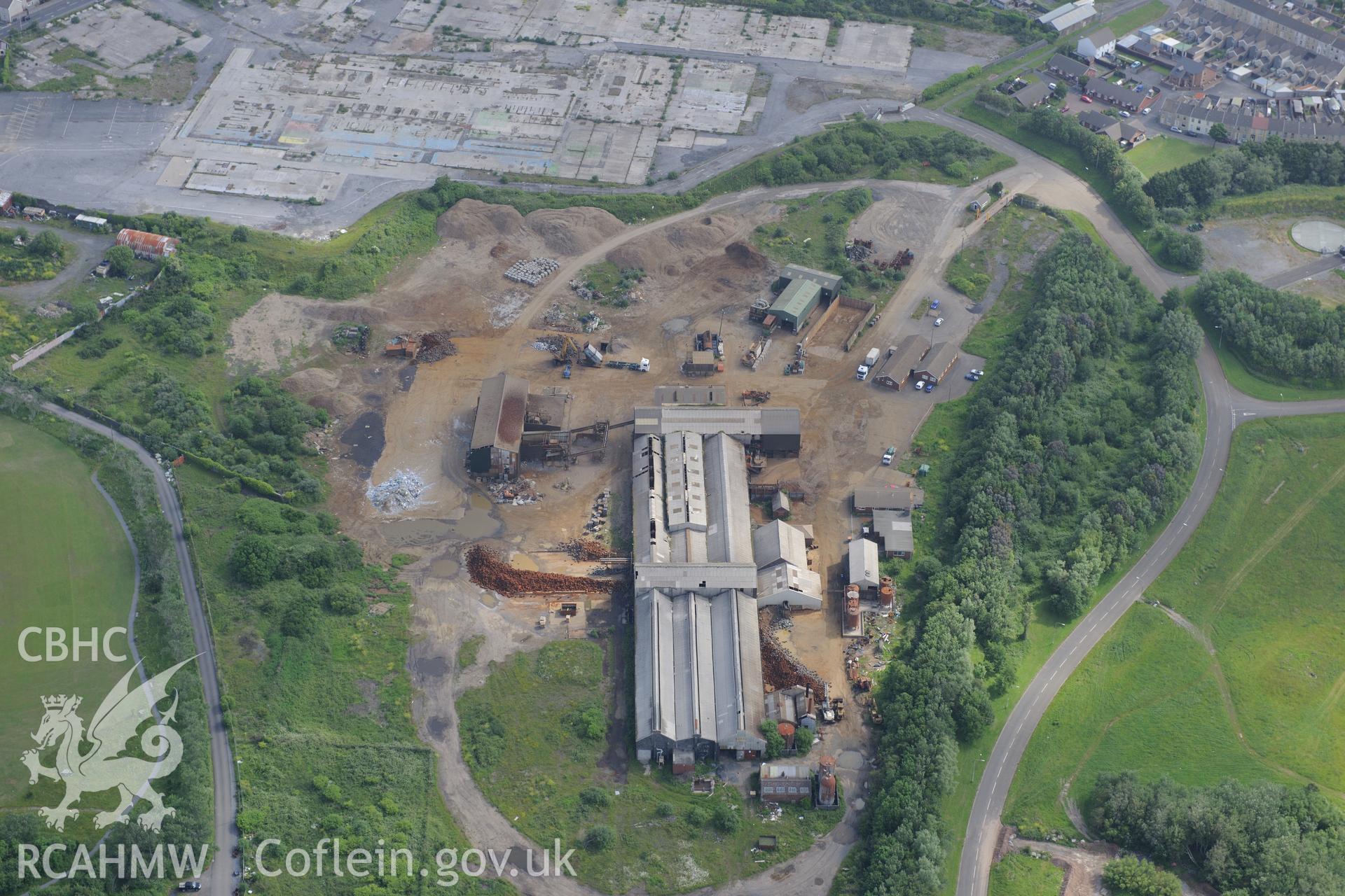 Site of the former copperworks dock; tinhouse and wern Canal. Now the site of an AMG scrap processing facility, Llanelli. Oblique aerial photograph taken during the Royal Commission's programme of archaeological aerial reconnaissance by Toby Driver on 19th June 2015.