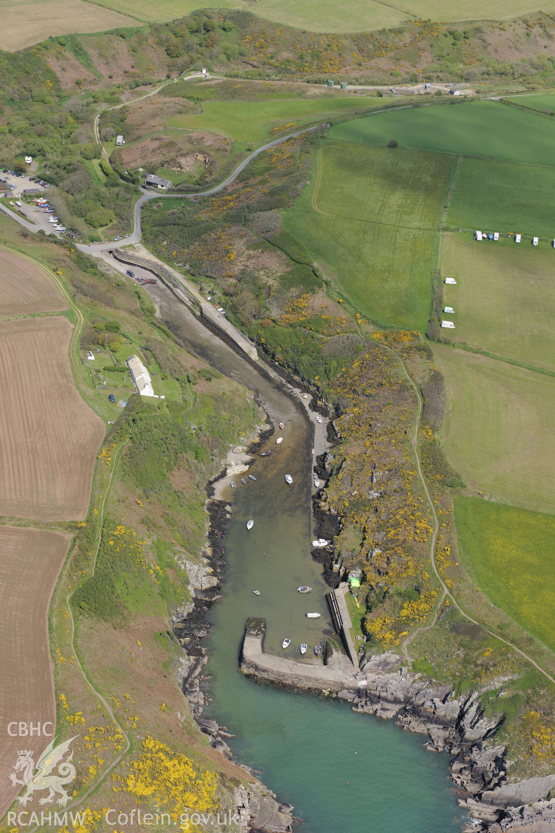 Porthclais harbour and lime kilns near St. David's. Oblique aerial photograph taken during the Royal Commission's programme of archaeological aerial reconnaissance by Toby Driver on 13th May 2015.