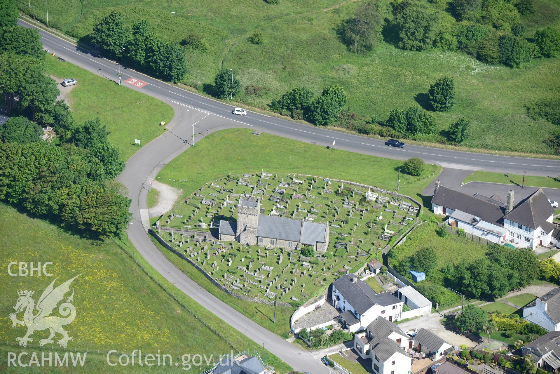 St. Mary Magdalen's Church and The Angel Inn, Mawdlam. Oblique aerial photograph taken during the Royal Commission's programme of archaeological aerial reconnaissance by Toby Driver on 19th June 2015.