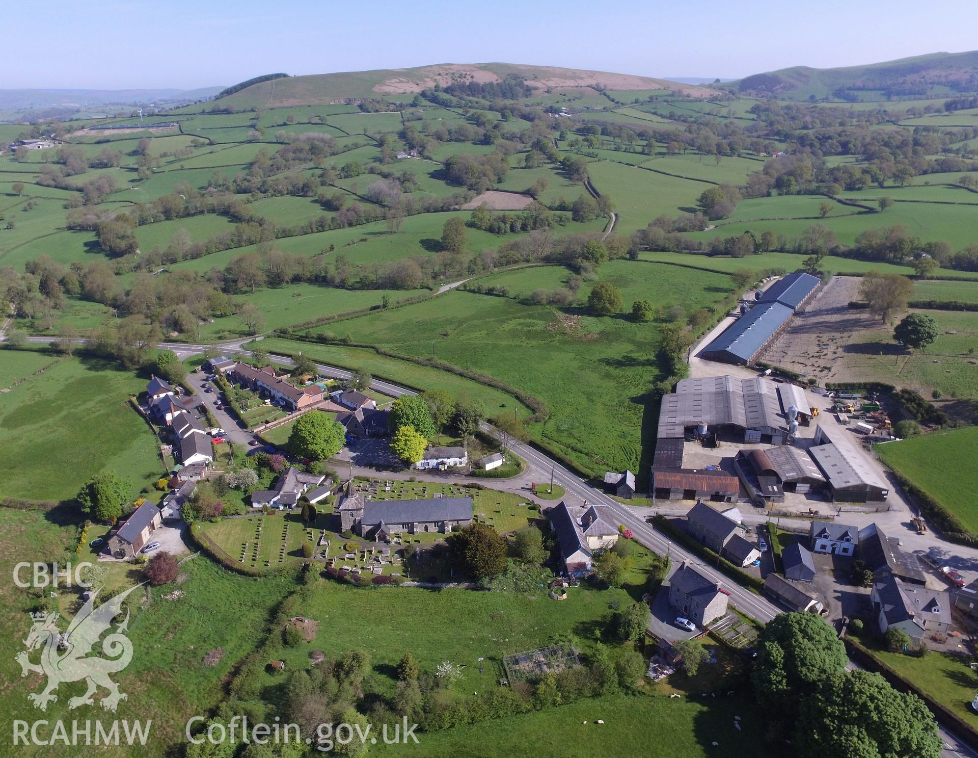 Colour photo showing aerial view of St. Tecla's Church and the village of Llandegley, taken by Paul R. Davis, 19th May 2018.