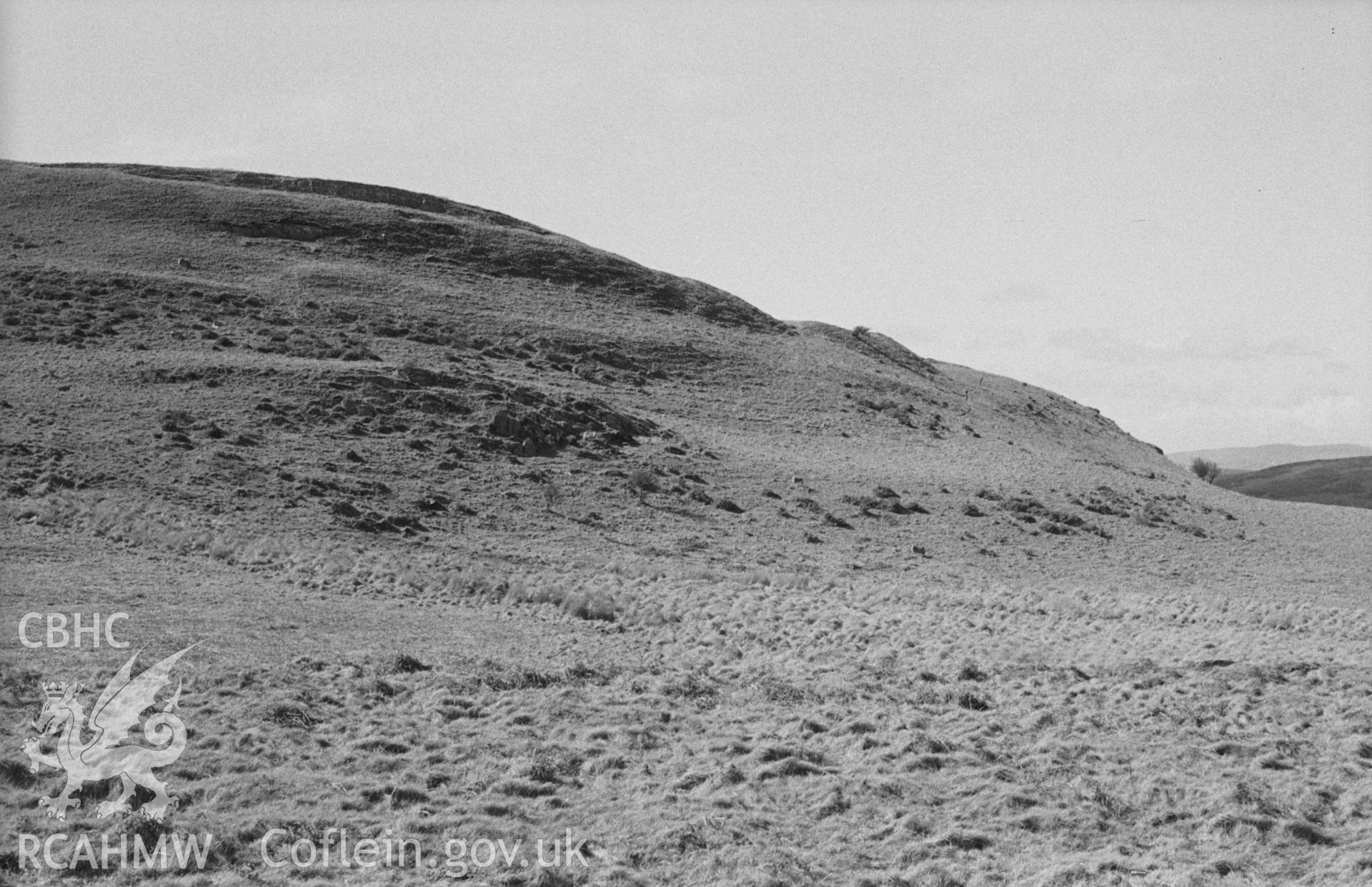 Digital copy of a black and white negative showing view of Pen Dinas, Elerch. Entrance through ramparts on the left. Photographed in April 1963 by Arthur O. Chater from Grid Reference SN 6788 8758, looking west north west.