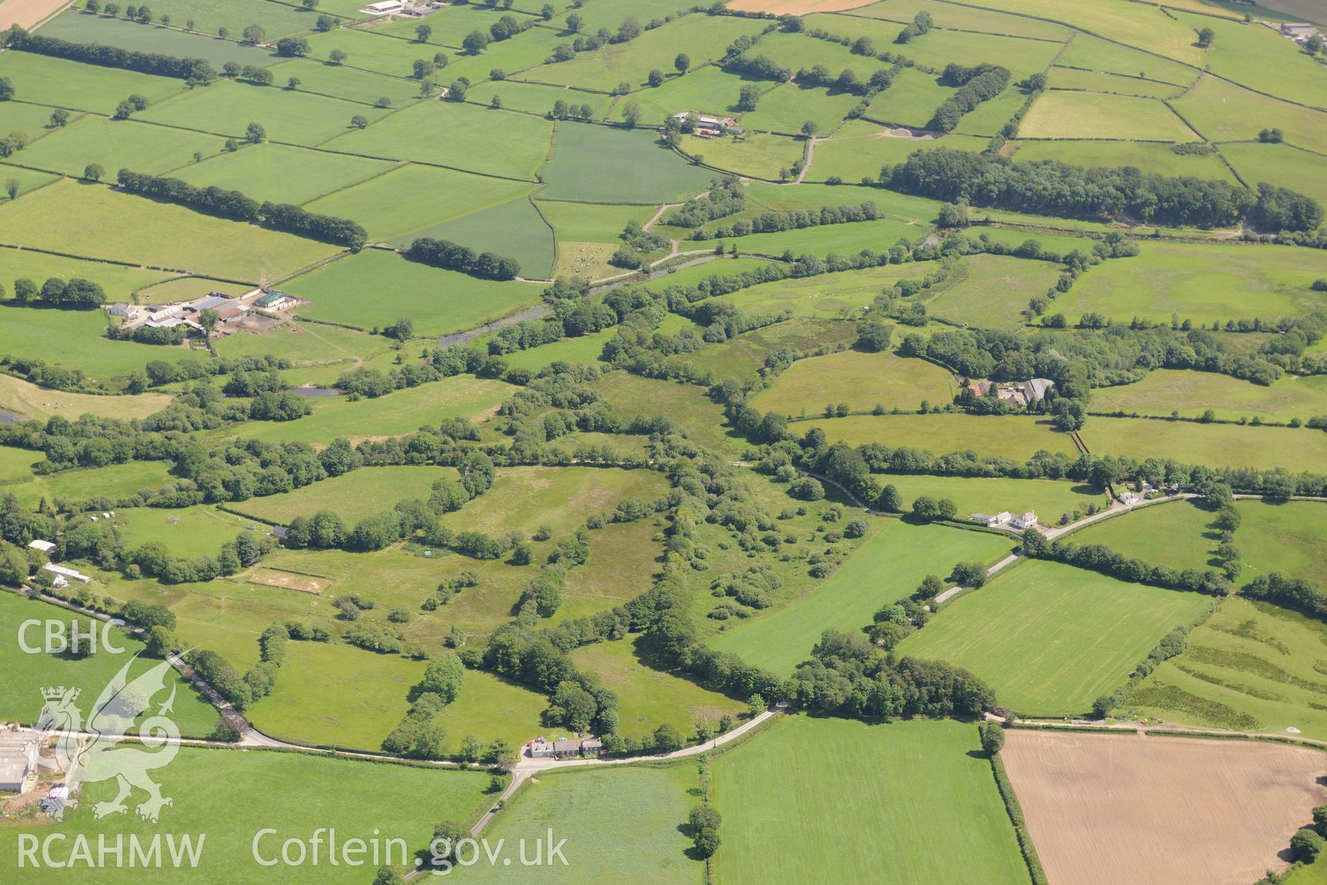 Bremia or Llanio Roman fort and settlement and the possible location of a Roman shrine where a Roman wooden head was discovered in the nineteenth century, north east of Llanddewi Brefi. Oblique aerial photograph taken during the Royal Commission's programme of archaeological aerial reconnaissance by Toby Driver on 30th June 2015.