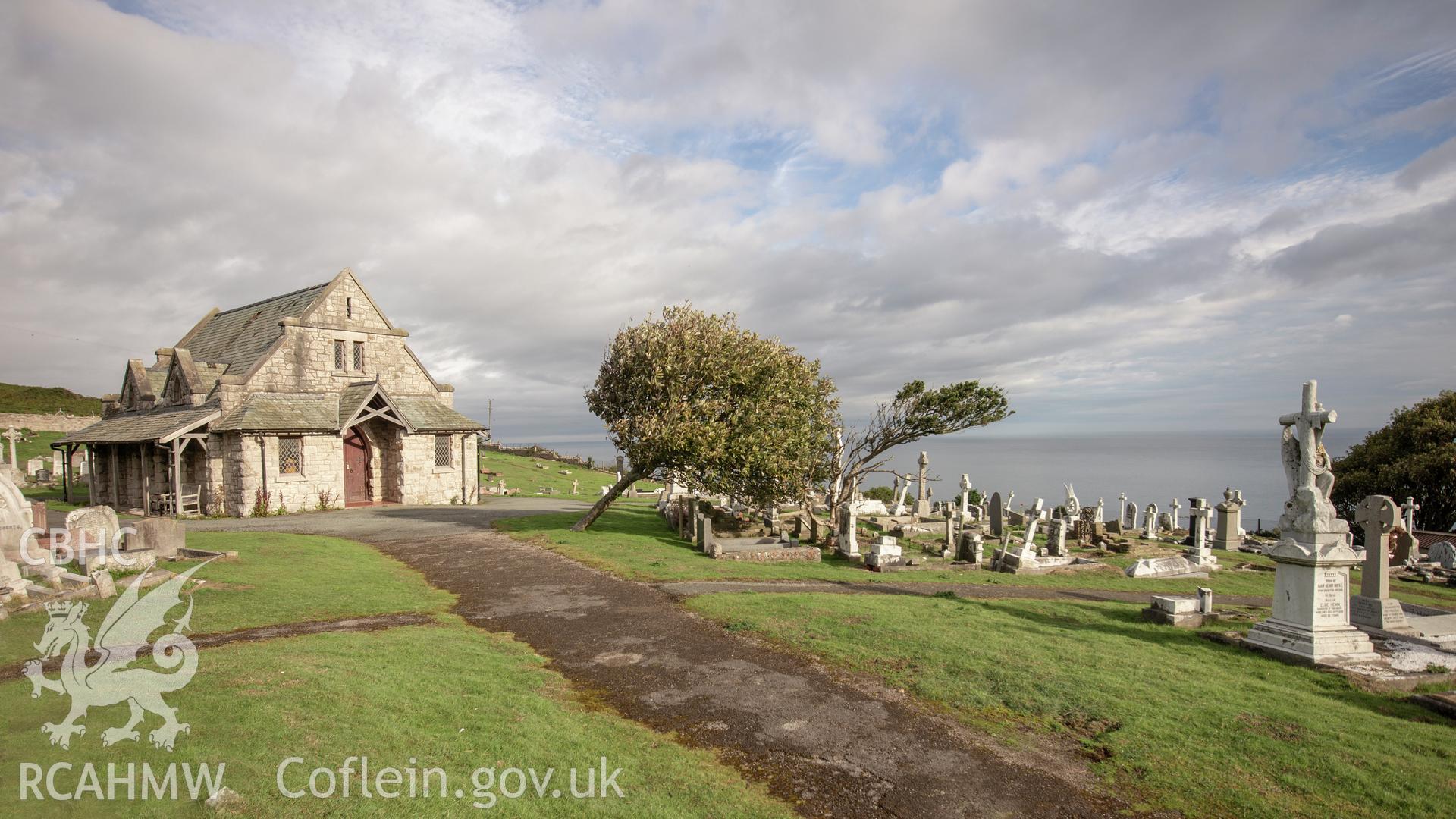 Colour photograph showing front elevation, side elevation and entrance of the Great Orme Cemetery chapel near St. Tudno's church, Llandudno. Photographed by Richard Barrett on 17th September 2018.