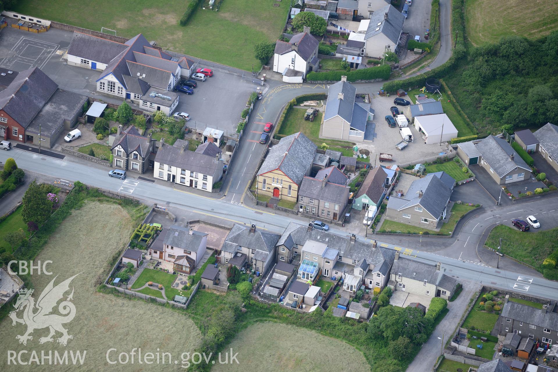 Ysgol Gynradd Chwilog and Capel Uchaf Calvinistic Methodist chapel in Chwilog, near Pwllheli. Oblique aerial photograph taken during the Royal Commission's programme of archaeological aerial reconnaissance by Toby Driver on 23rd June 2015.