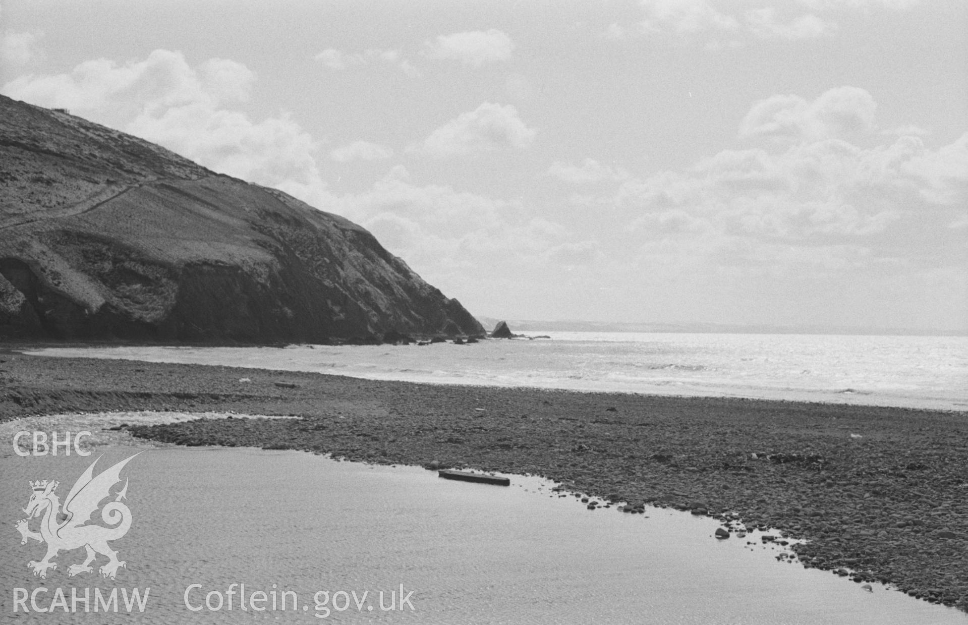 Digital copy of a black and white negative showing dammed up part of Afon Clarach on Clarach beach, Craigyfulfran beyond. Photographed by Arthur O. Chater on 2nd April 1968, looking south south west from Grid Reference SN 587 840.