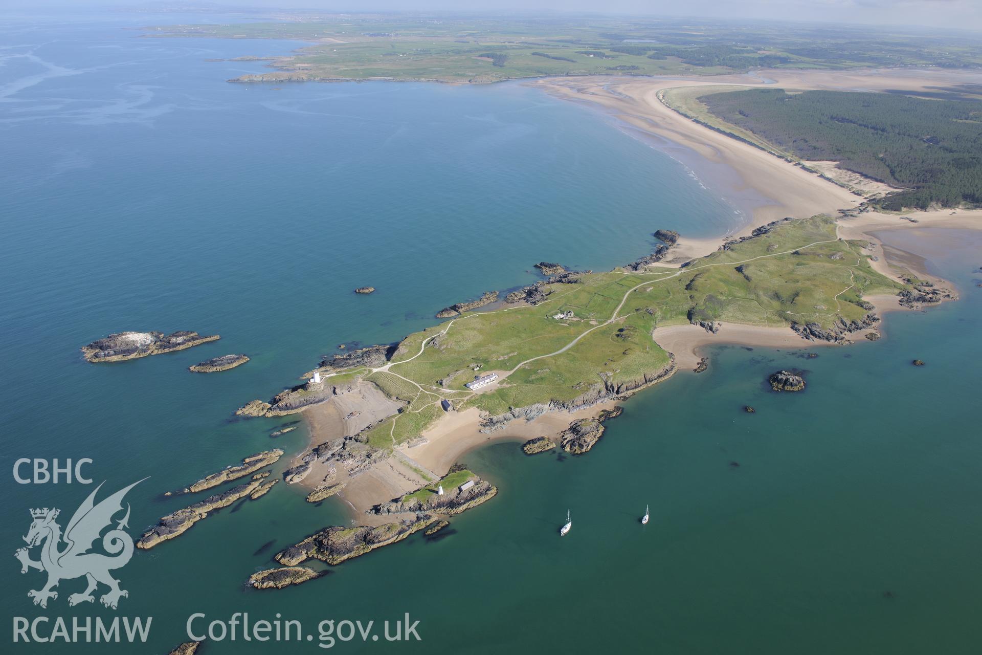 Llanddwyn Island, with Ynys yr Adar beyond (larger of the small islands). Oblique aerial photograph taken during the Royal Commission's programme of archaeological aerial reconnaissance by Toby Driver on 23rd June 2015.