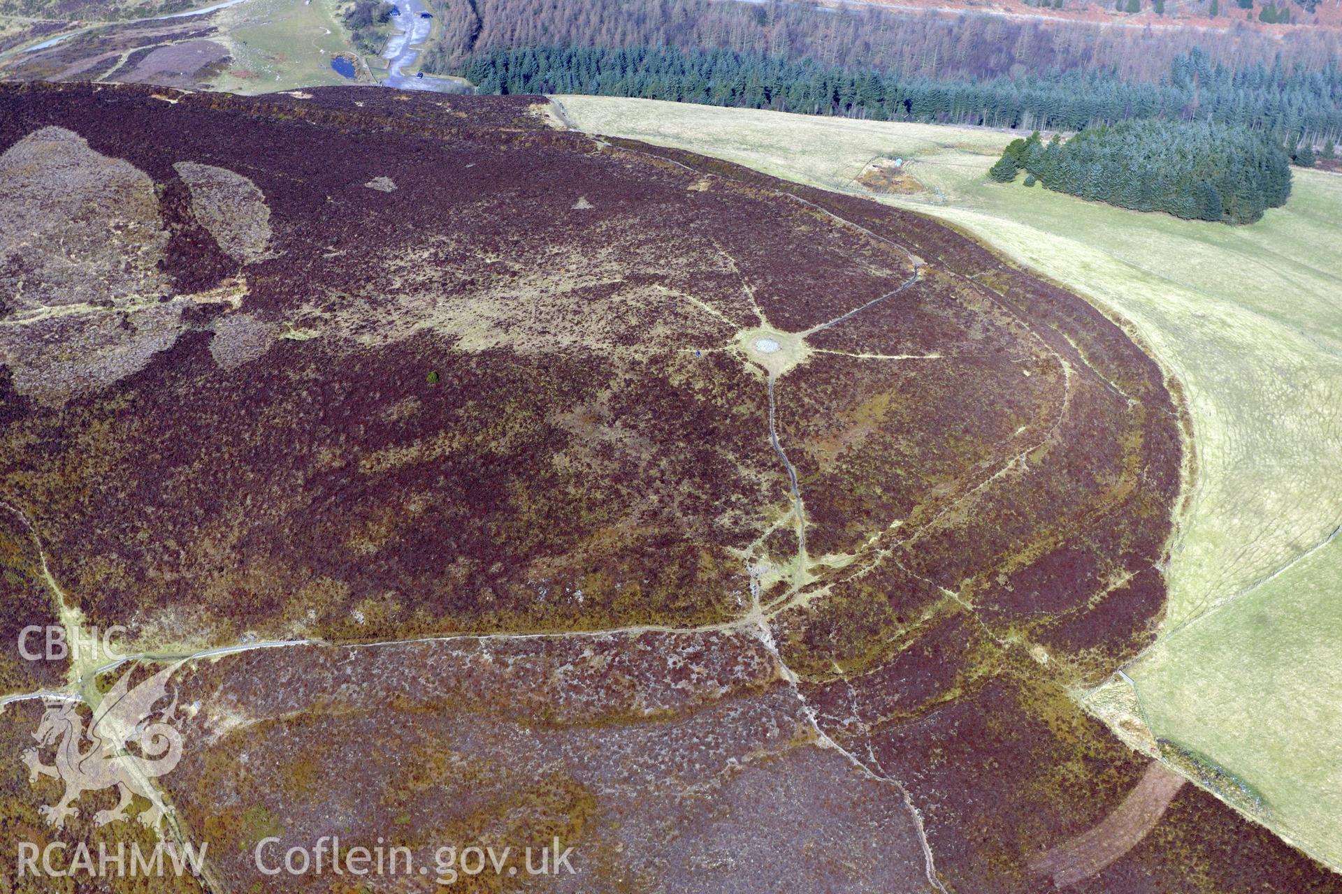 Foel Fenlli Hillfort and Cairn, between Ruthin and Mold. Oblique aerial photograph taken during the Royal Commission?s programme of archaeological aerial reconnaissance by Toby Driver on 28th February 2013.
