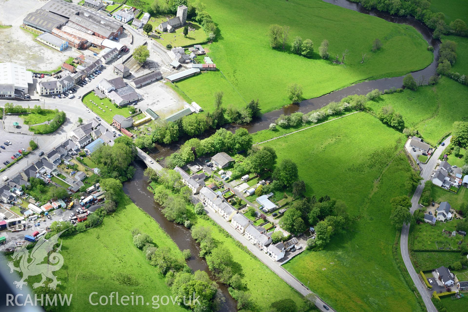 St. Peter's Church, Llanybydder Bridge and Llanybydder Livestock Market, Llanybydder. Oblique aerial photograph taken during the Royal Commission's programme of archaeological aerial reconnaissance by Toby Driver on 3rd June 2015.