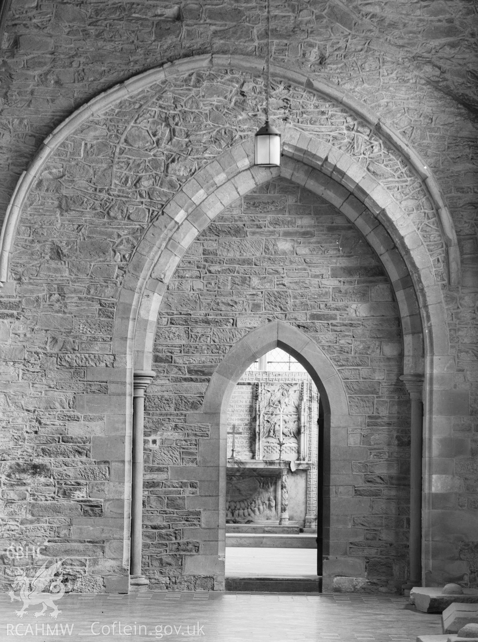 Digital copy of a black and white nitrate negative showing detail of interior archway at St. David's Cathedral, taken by E.W. Lovegrove, July 1936.