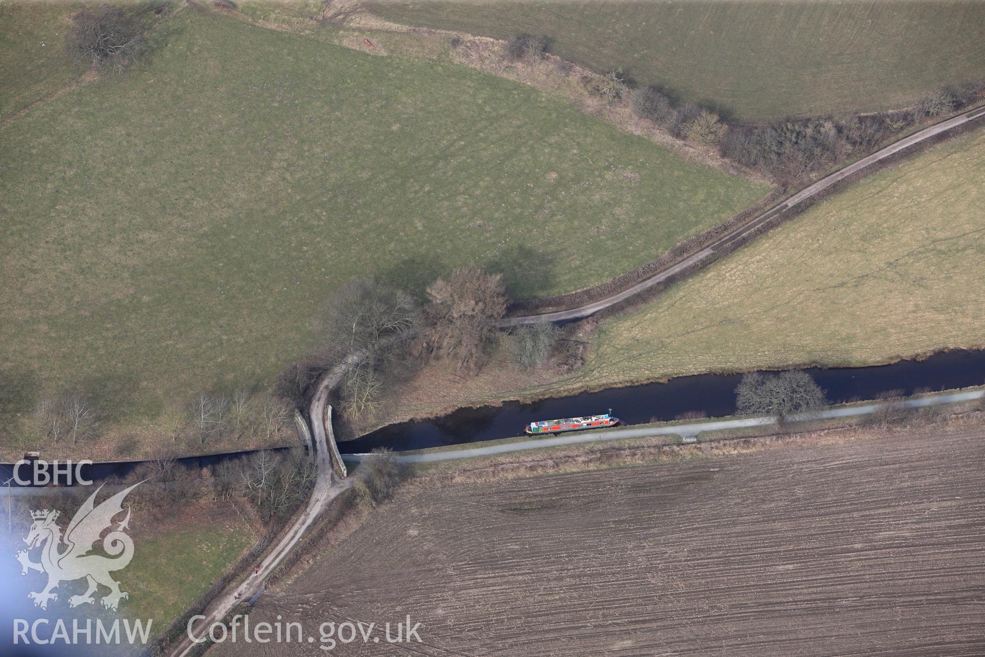 Plas-yn-y-Pentre Brdige no. 34, crossing the Llangollen canal north west of Froncysyllte. Oblique aerial photograph taken during the Royal Commission?s programme of archaeological aerial reconnaissance by Toby Driver on 28th February 2013.