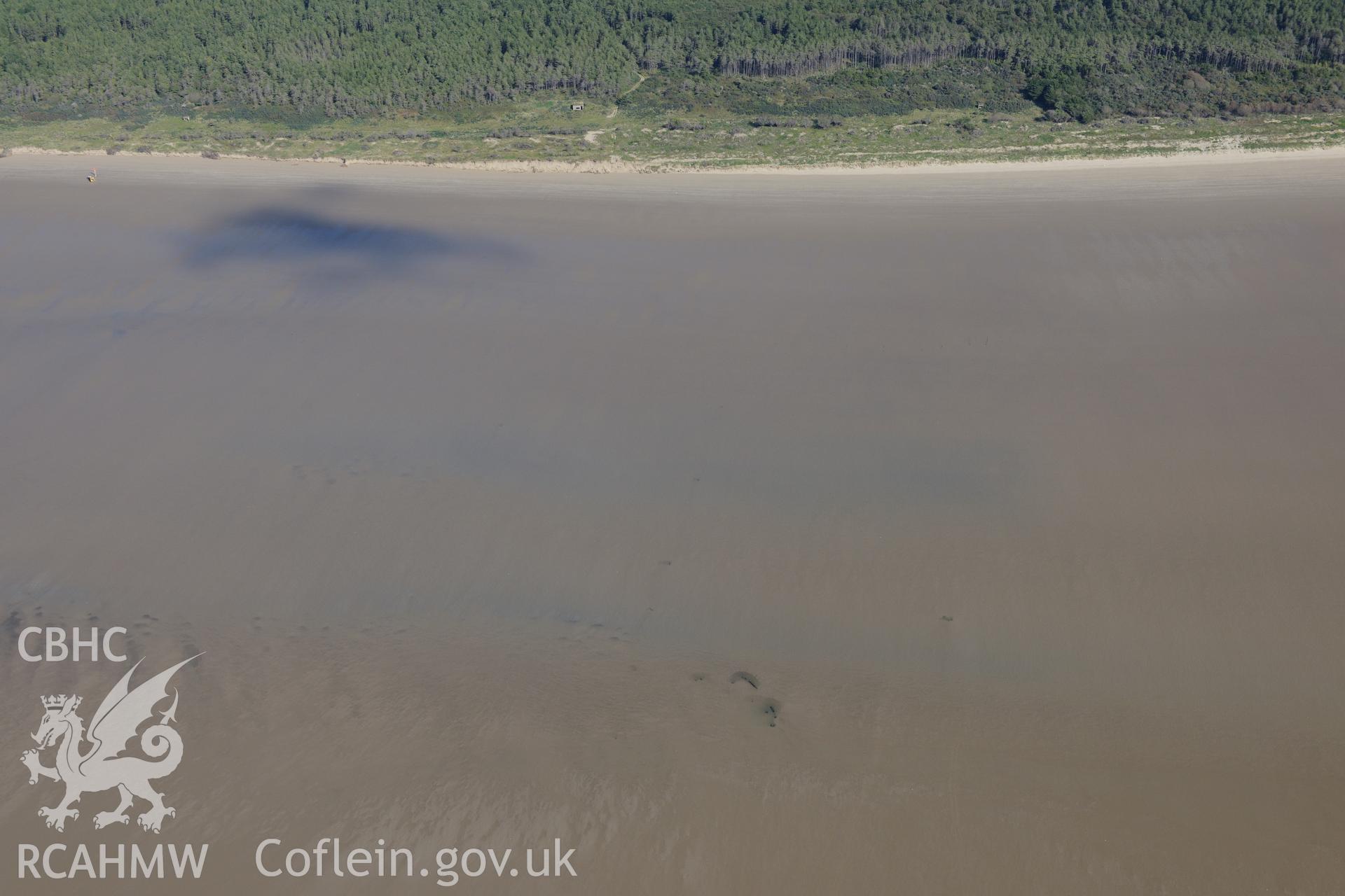 Post medieval wreck on the Cefn Sidan sands, Pembrey, at low tide. Oblique aerial photograph taken during the Royal Commission's programme of archaeological aerial reconnaissance by Toby Driver on 30th September 2015.