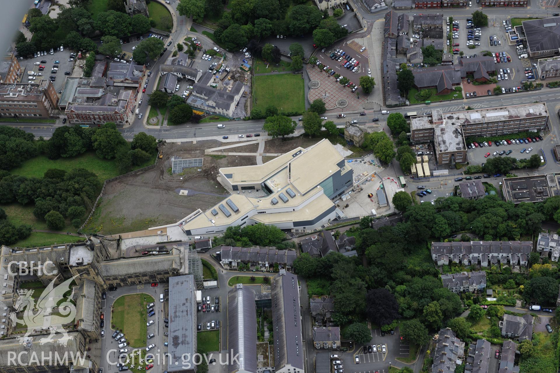Bangor University, Theatr Gwynedd(demolished),Pontio, medieval church site, town hall, library & war memorial. Oblique aerial photograph taken during the Royal Commission's programme of archaeological aerial reconnaissance by Toby Driver on 30th July 2015.