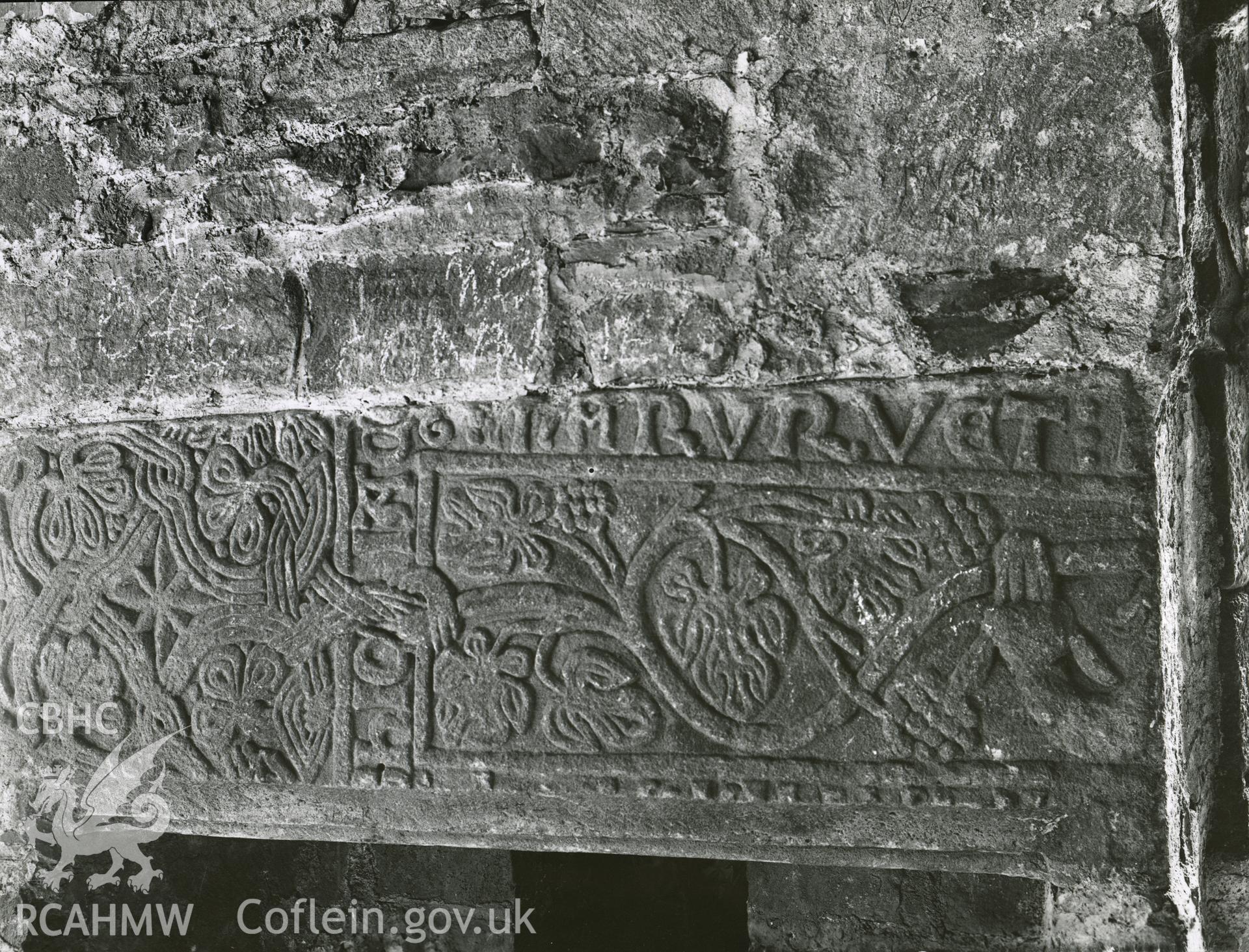 Digitised copy of a black and white photograph showing grave slab at Valle Crucis Abbey, taken by F.H. Crossley, 1949. Copied from print as negative held by NMR England (Historic England).