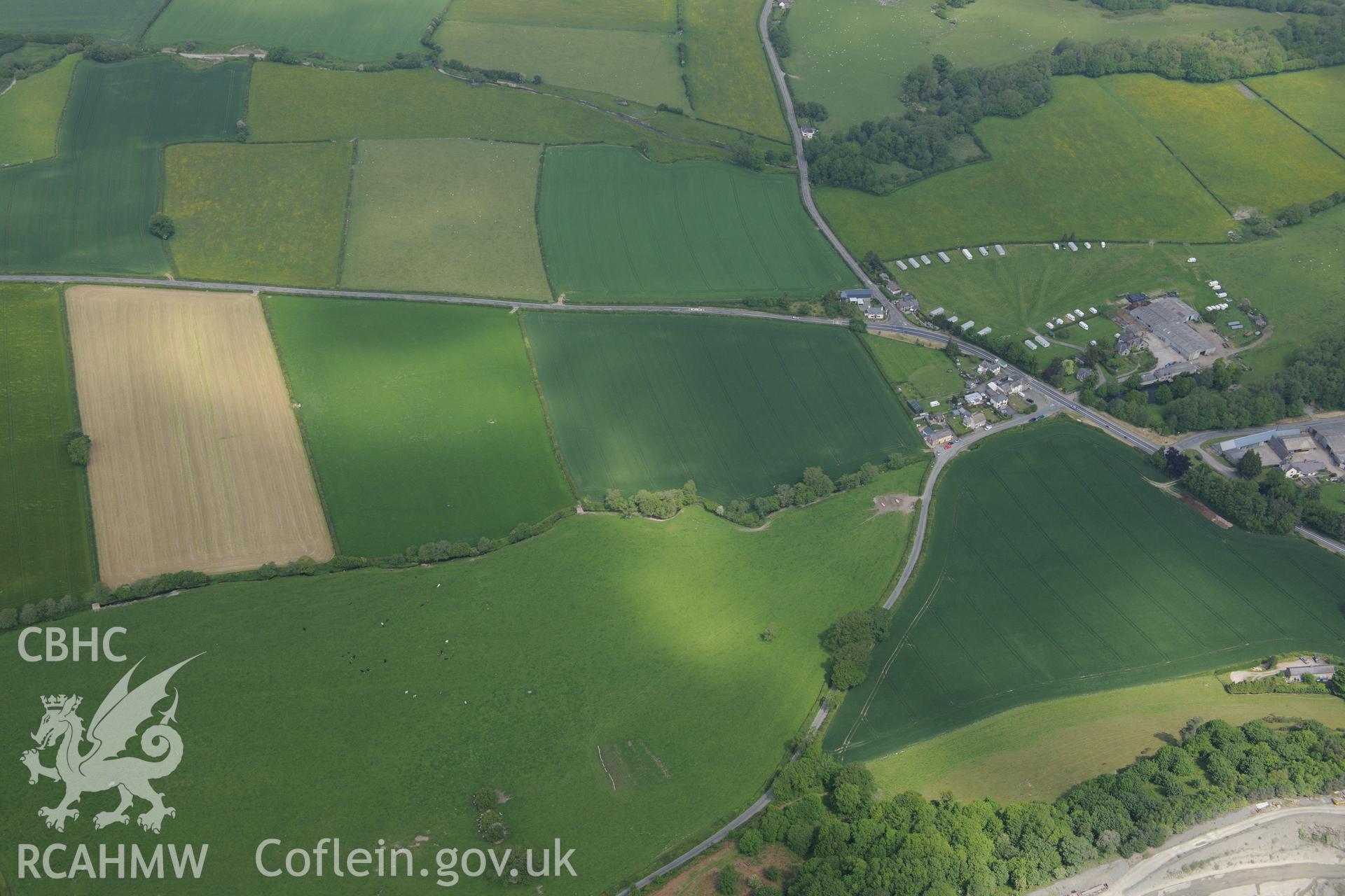 Walton Court Farmstead; Walton Road Camp I and II; cropmark ringditch south west of Walton; cropmark west of Walton; Court Farm barrow; cropmark enclosure and cropmark ringdith north of Ridding Brook. Oblique aerial photograph taken during the Royal Commission's programme of archaeological aerial reconnaissance by Toby Driver on 11th June 2015.
