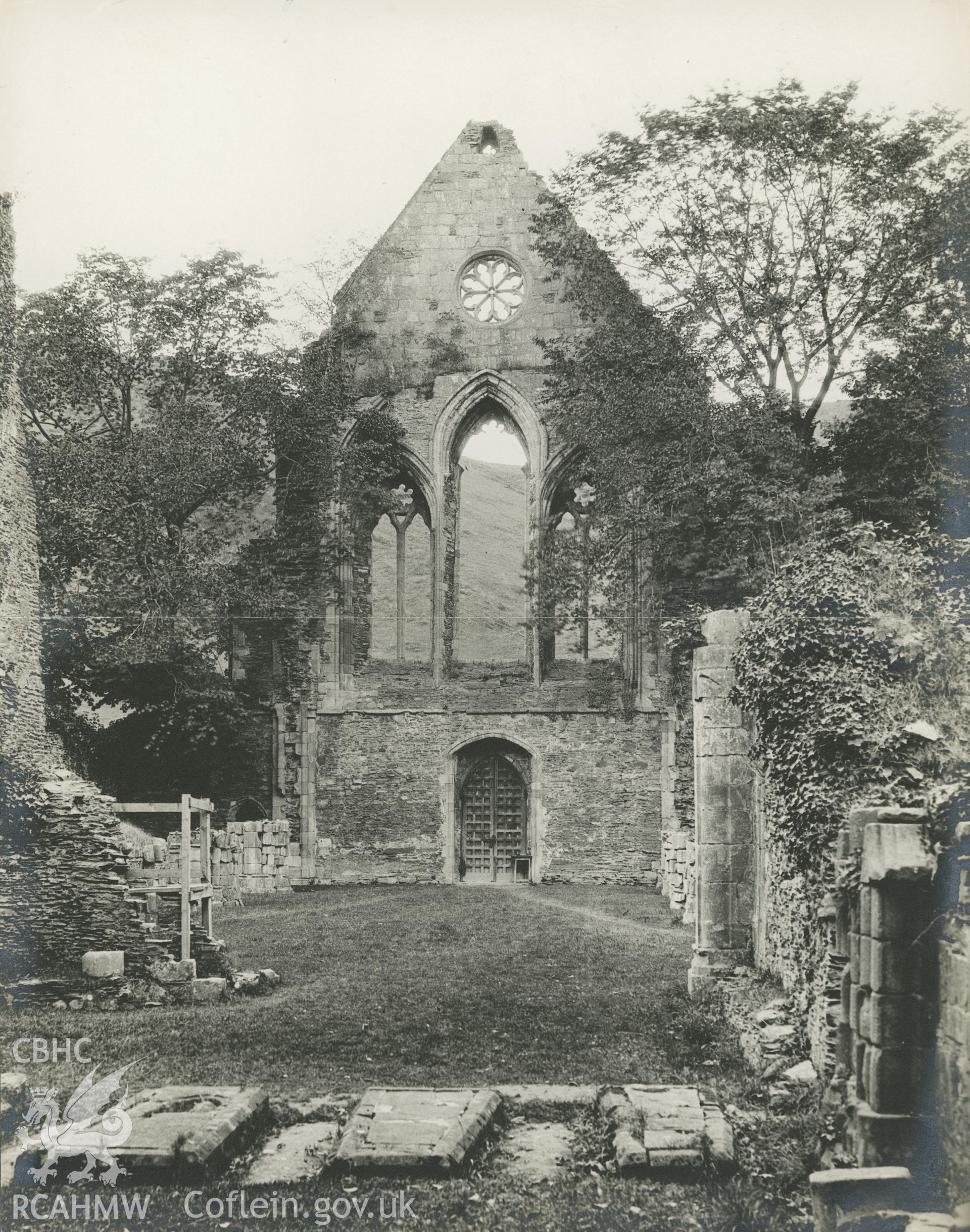 Digitised copy of an undated black and white photograph showing interior view of Valle Crucis Abbey looking east, taken by J. Harold Daniel.