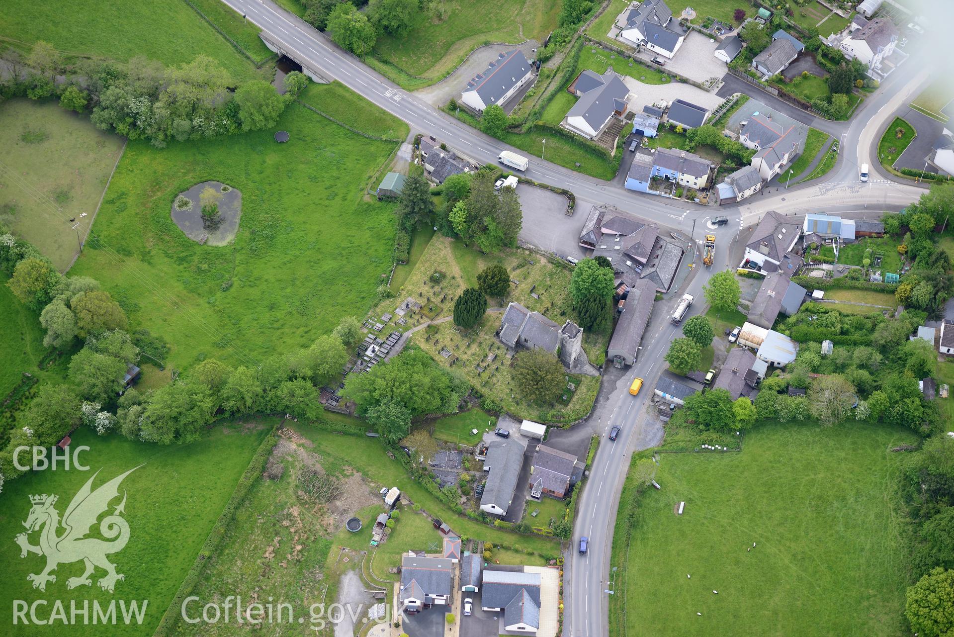 St. Gwynin's Church and Llanwnnen Village. Oblique aerial photograph taken during the Royal Commission's programme of archaeological aerial reconnaissance by Toby Driver on 3rd June 2015.