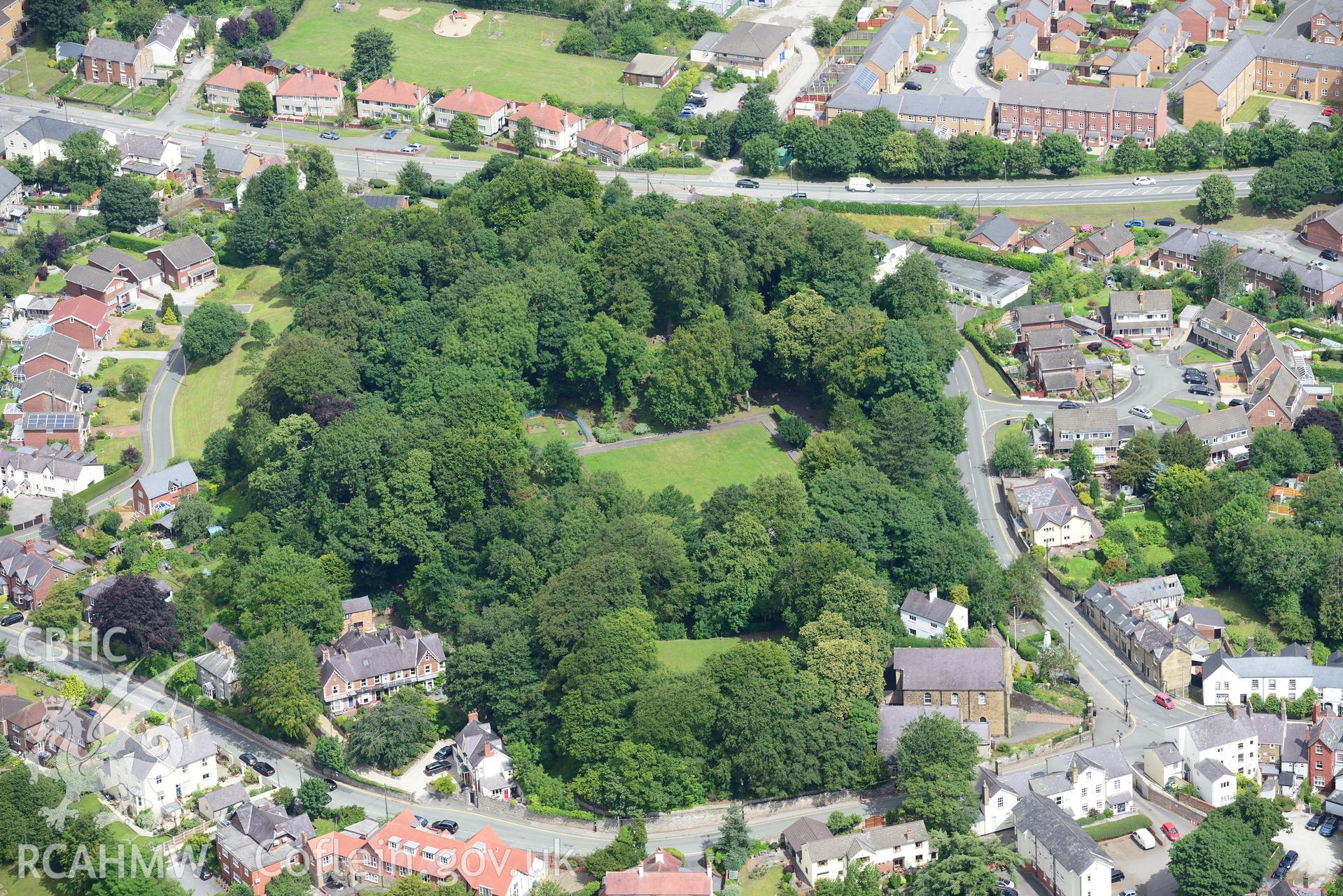 Mold Castle, Bailey Hill and Pendref Methodist Church, Mold. Oblique aerial photograph taken during the Royal Commission's programme of archaeological aerial reconnaissance by Toby Driver on 30th July 2015.