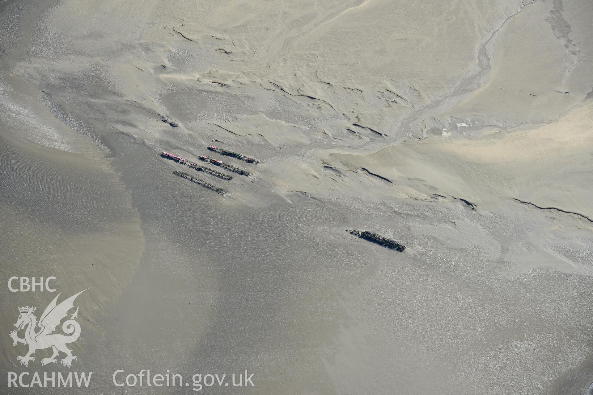 Cocklers on Llanrhidian Sands, on the northern shores of the Gower Peninsula. Oblique aerial photograph taken during the Royal Commission's programme of archaeological aerial reconnaissance by Toby Driver on 30th September 2015.