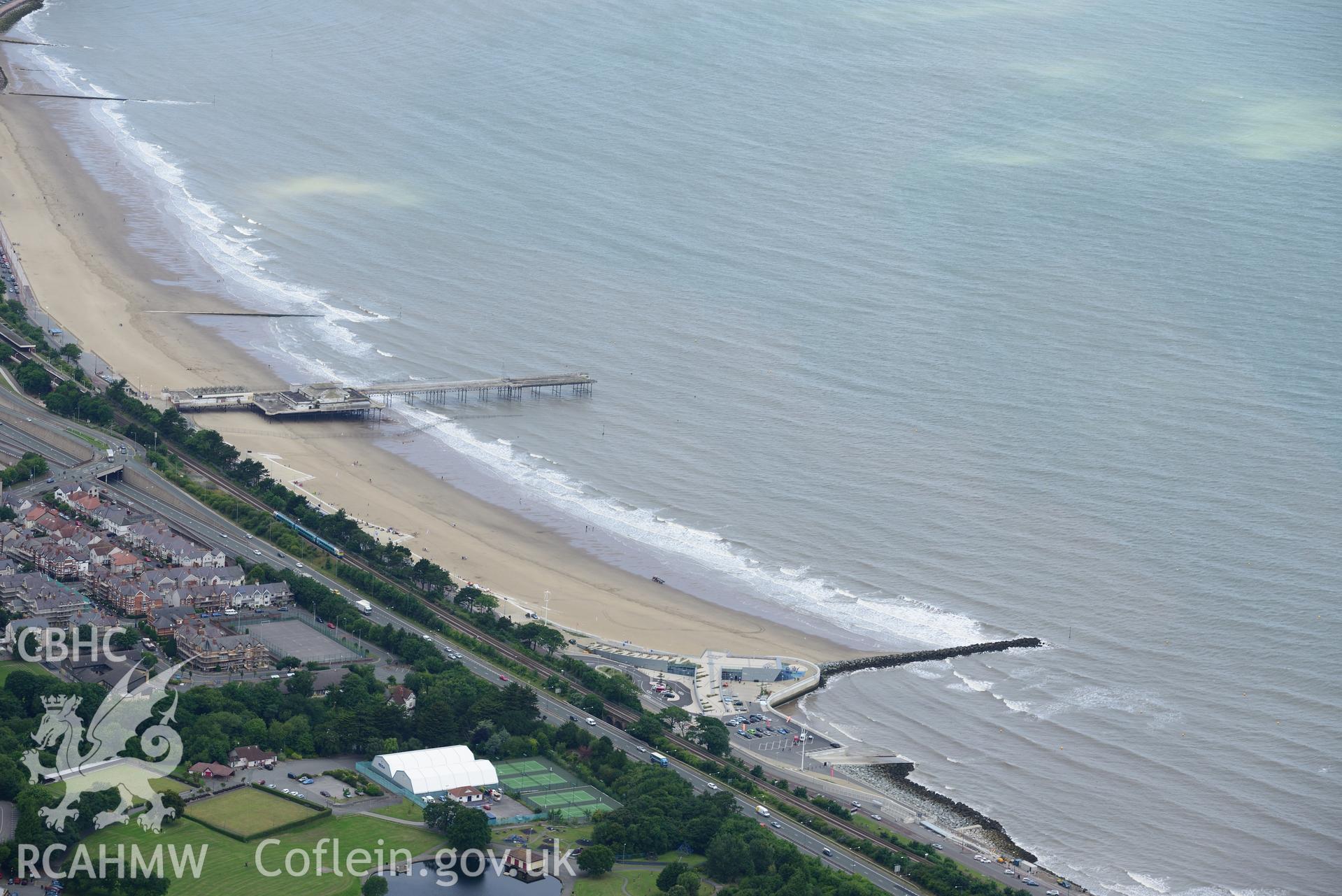 Victoria Pier and Pavilion, Colwyn Bay. Oblique aerial photograph taken during the Royal Commission's programme of archaeological aerial reconnaissance by Toby Driver on 30th July 2015.